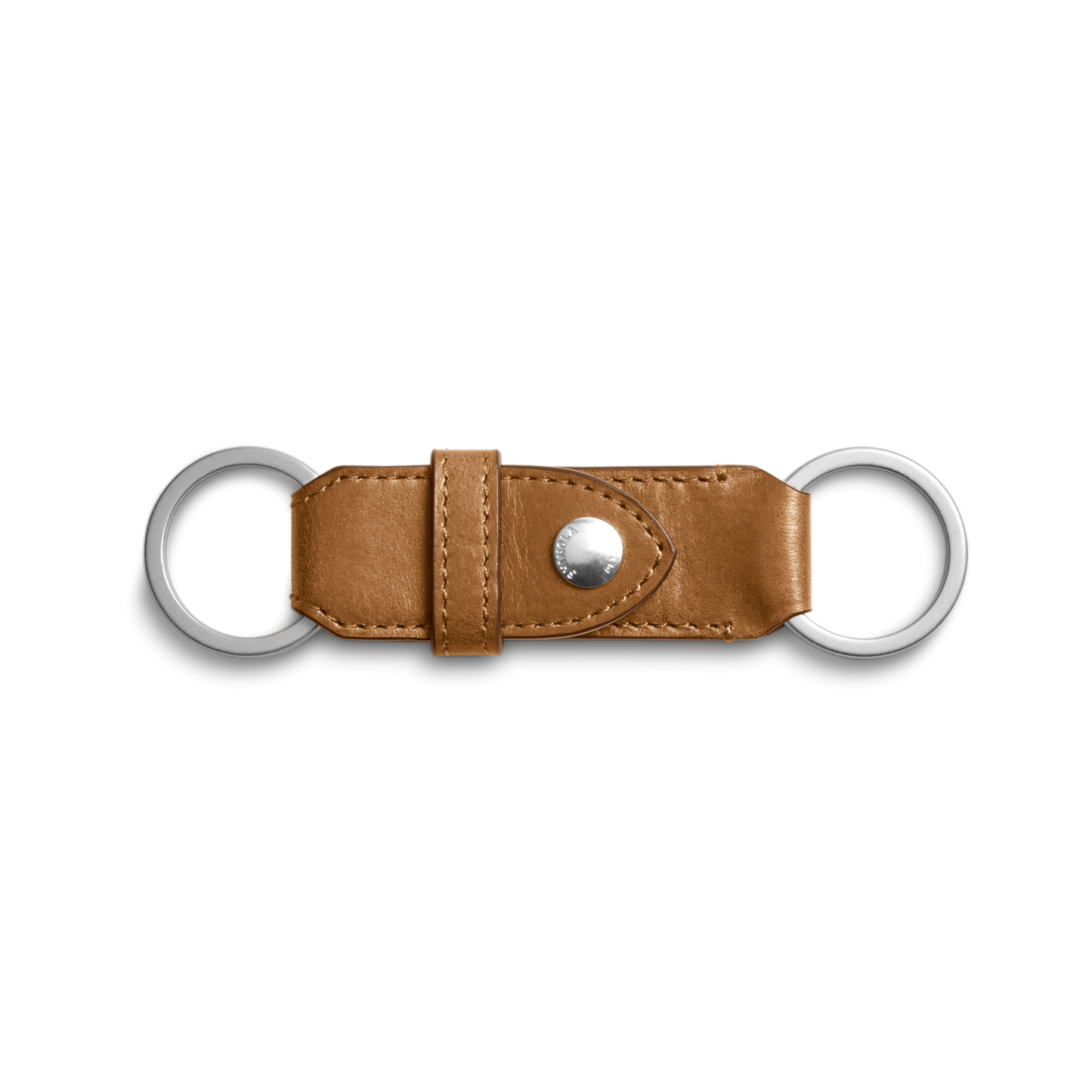 The Shinola Leather Valet Key Fob in brown features two silver metal rings on each end and a central snap button, showcased against a white background.
