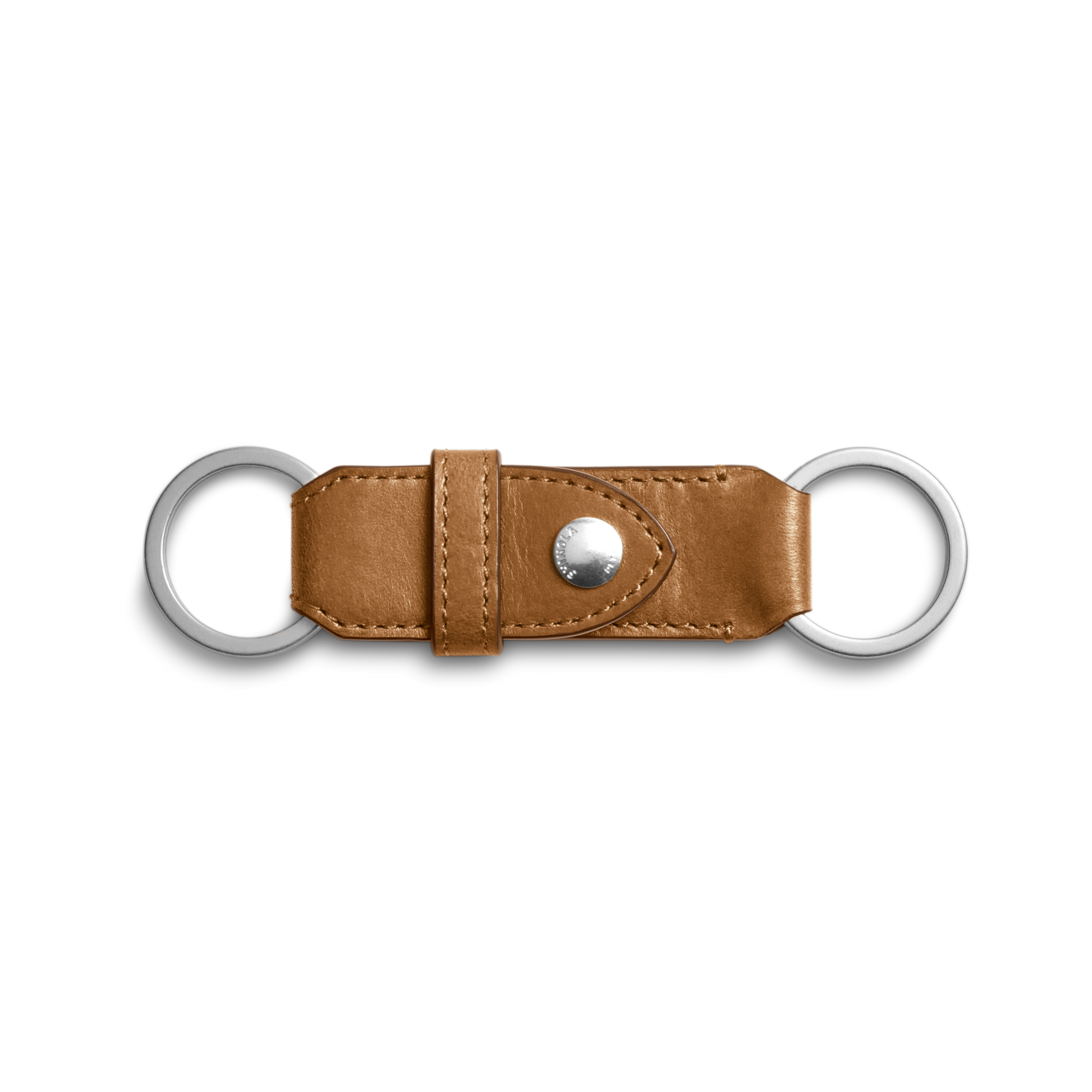 The Shinola Leather Valet Key Fob in brown features two silver metal rings on each end and a central snap button, showcased against a white background.