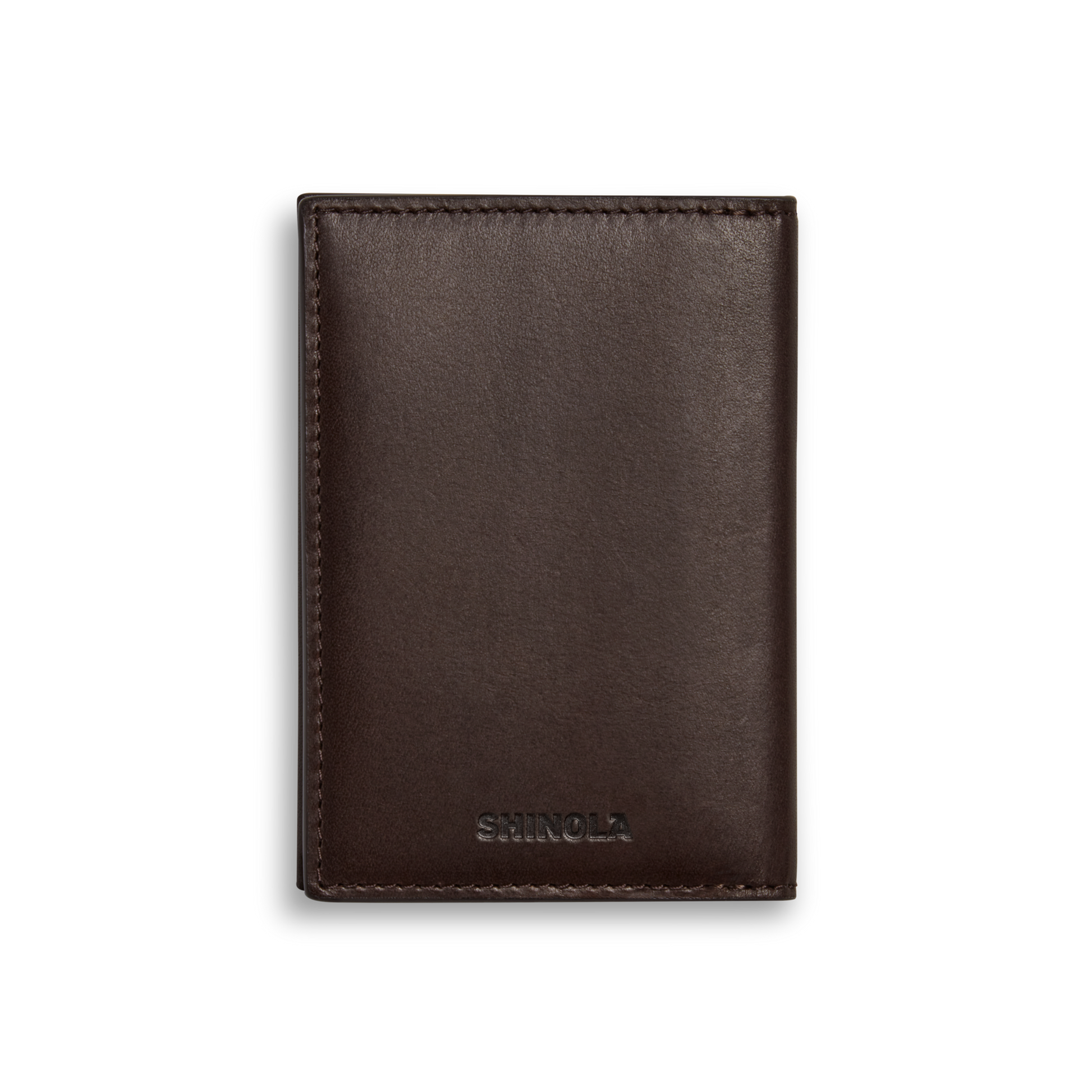 The Folded Card Holder Wallet - Dark Brown by Shinola is a slim, closed wallet made from Italian Vachetta leather with visible stitching and SHINOLA embossed near the bottom center, shown against a plain white background.