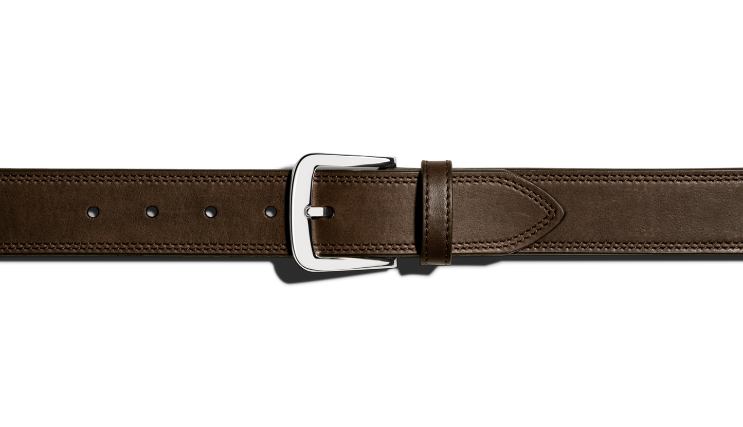 A close-up of the Shinola 1 1/2" Double Stitch Belt in Deep Brown, featuring premium leather, double stitching, and a shiny silver buckle on a plain white background.