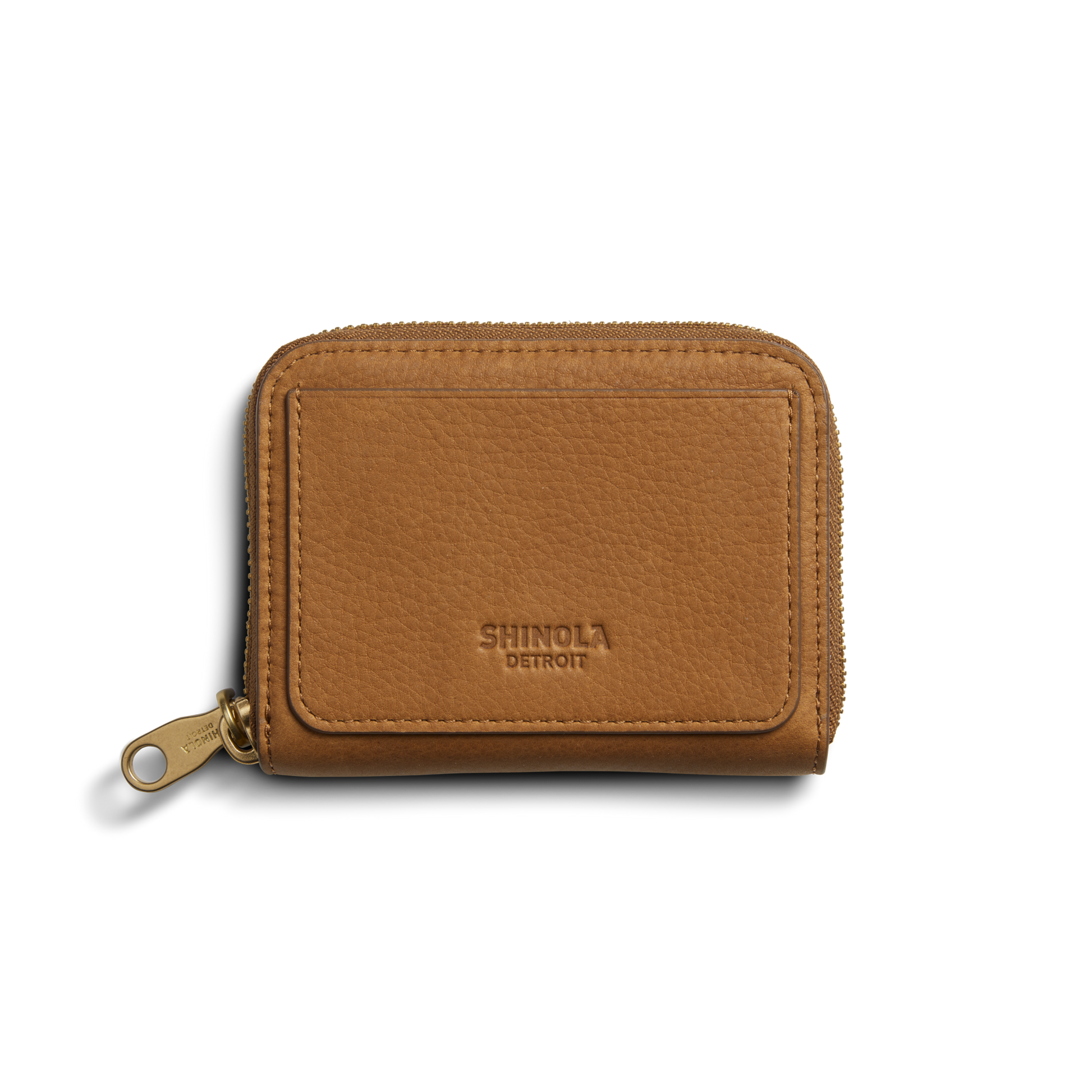 The Shinola Pocket Small Zip Around Wallet - Tan features natural leather, a gold zipper pull, and "Shinola Detroit" embossed on the front, shown on a plain white background.