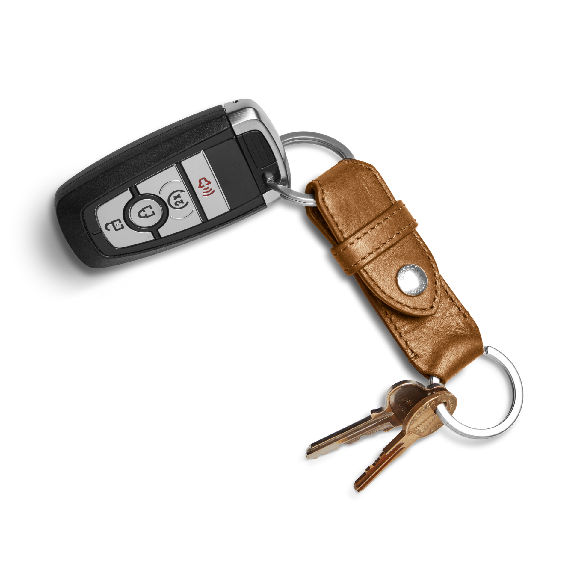 The Shinola Leather Valet Key Fob - Brown is attached to a key ring with two metal keys and placed on a white background.