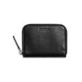 The Shinola Small Zip Wallet - Black features natural grain leather, compact design, and embossed branding on the front, shown against a plain white background.