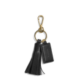 The Shinola Leather Tassel Keychain - Black features a gold clasp and ring, a black leather tassel, and a rectangular embossed tag—an elegant monogram keychain or stylish key fob.