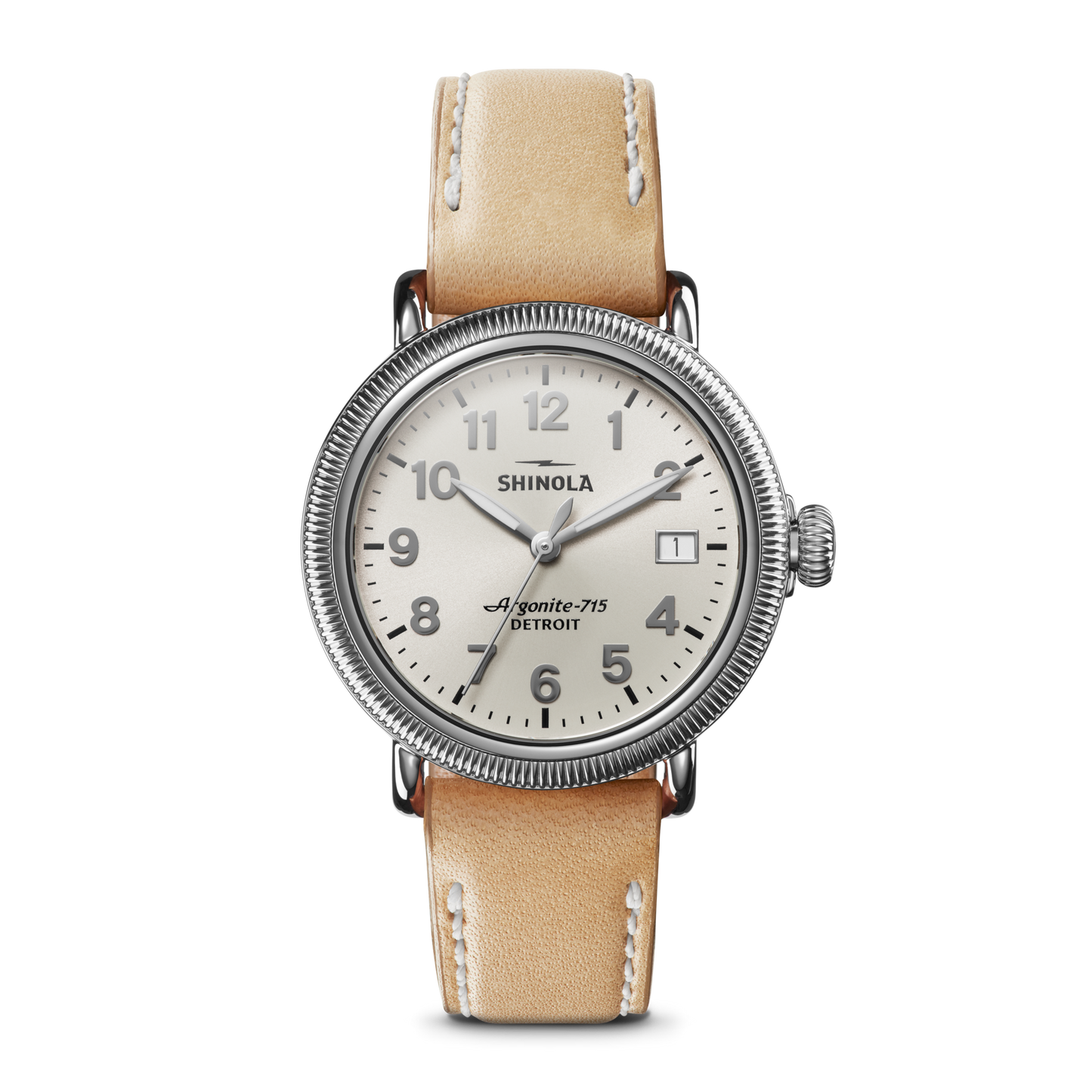 The Runwell Coin Edge Watch by Shinola features a beige leather strap, silver round case, white dial with silver Arabic numerals, three hands, and "Shinola" plus "Argonite-715 Detroit" printed above the center.
