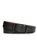 The Shinola 1 1/2" Lightning Bolt Keeper Belt in black nappa leather, featuring a matte black rectangular buckle with a subtle lightning bolt symbol, is shown coiled on a white background.