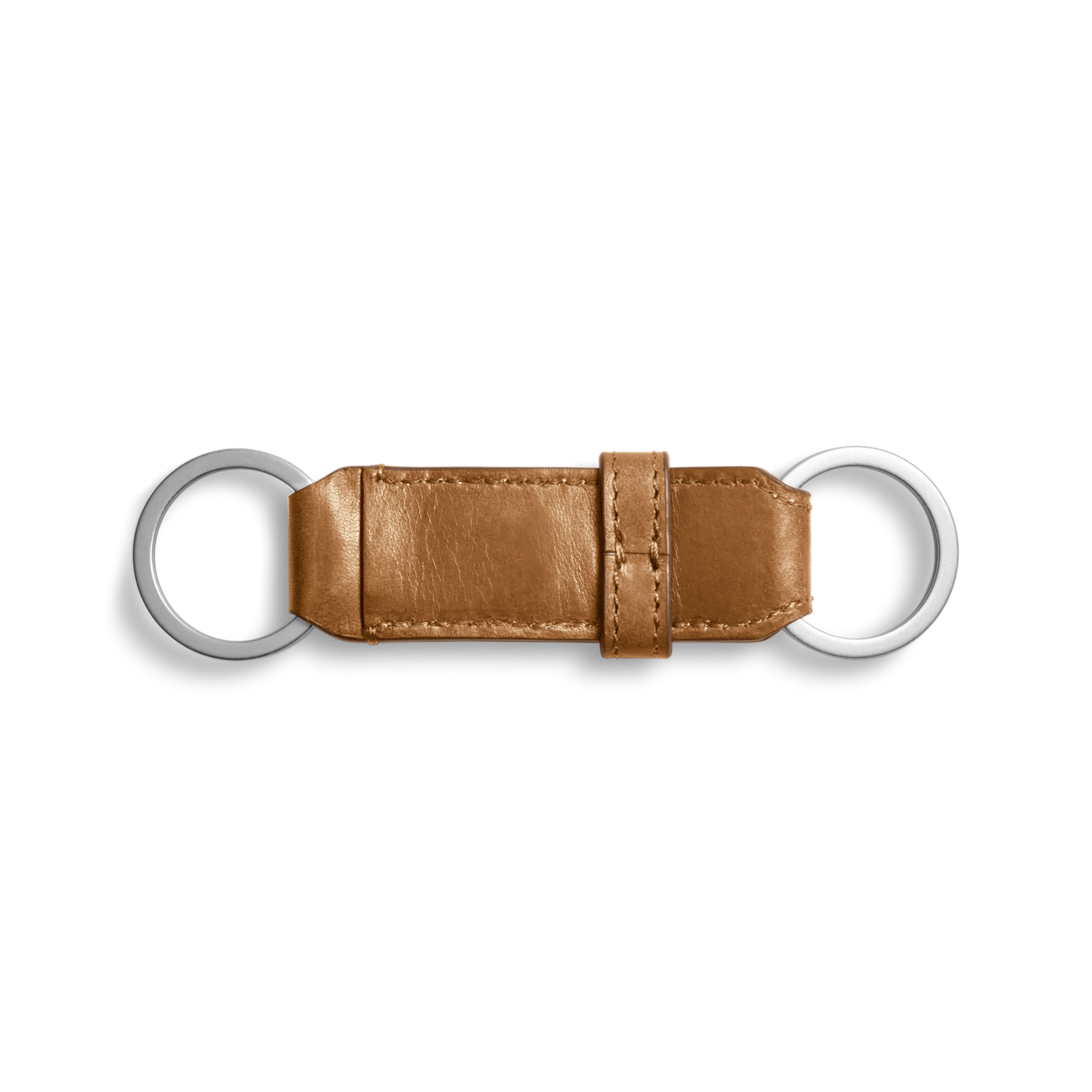The Shinola Leather Valet Key Fob - Brown features two silver metal rings linked by a rectangular tan leather strip with a central loop detail, set against a plain white background.