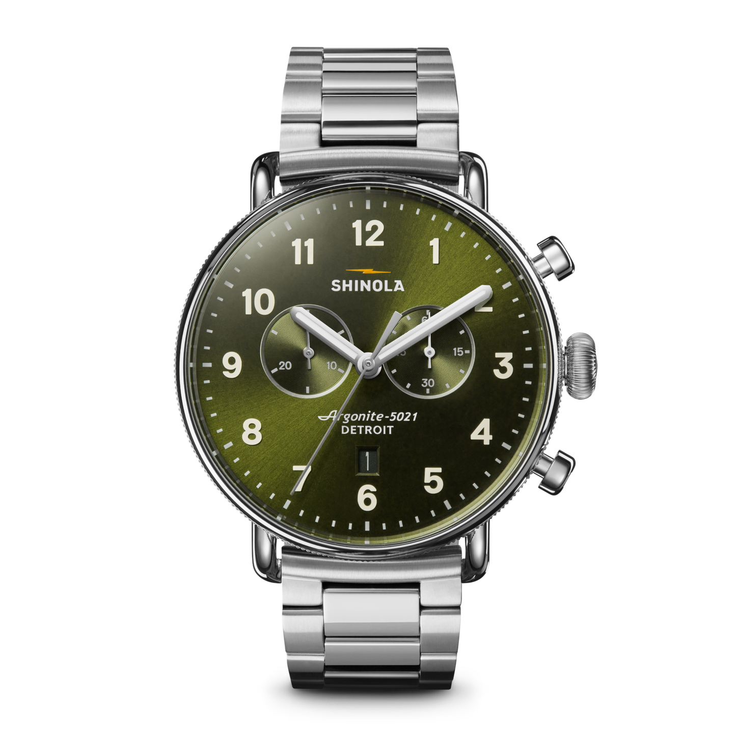 The Shinola Canfield Chronograph Watch - Dark Olive features a silver case, dark olive dial with white numerals, three subdials, and a stainless steel link band, shown against a white background.