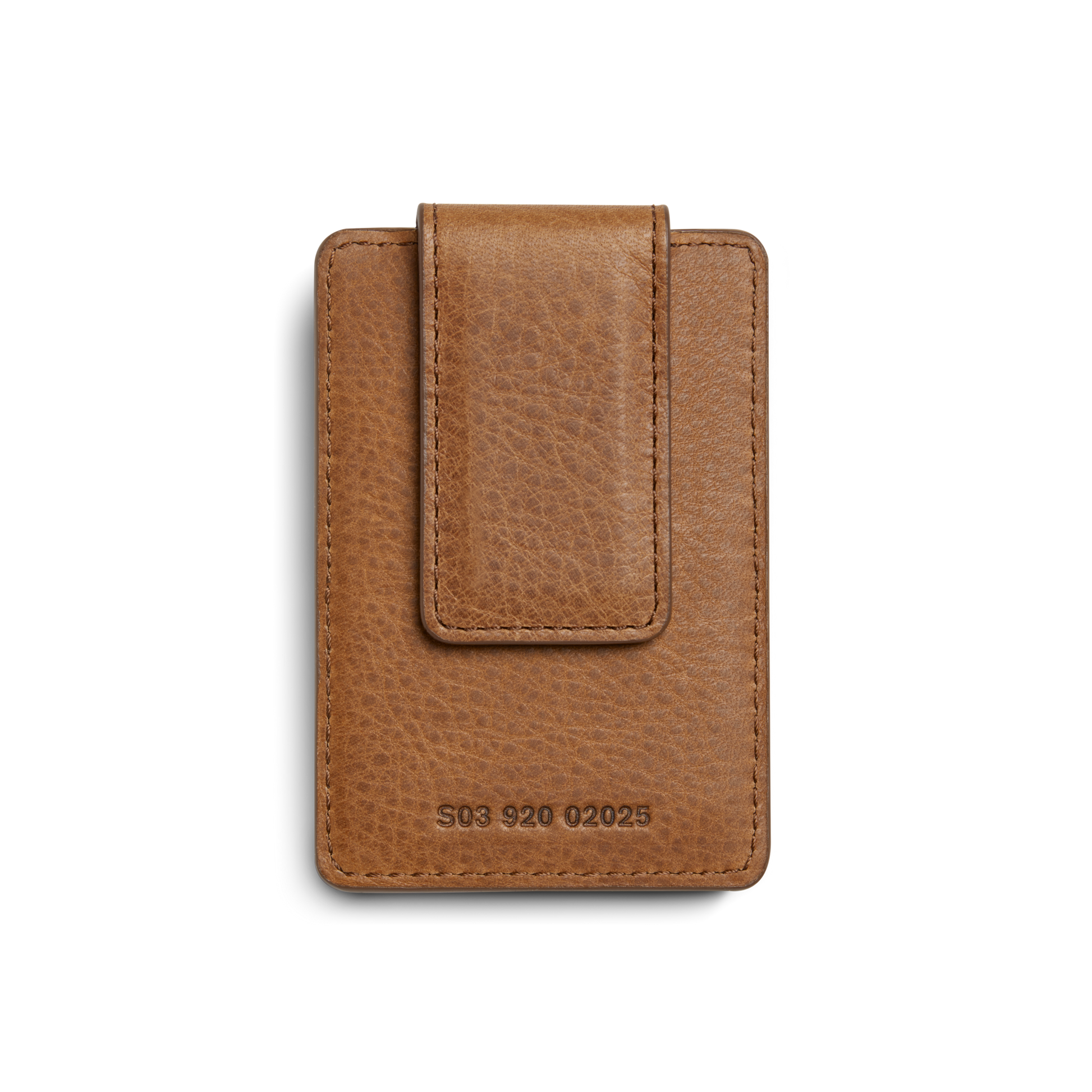 The Shinola Magnetic Money Clip Card Holder in tan leather features a textured finish, visible stitching, and embossed numbers S03 920 02025 on the front. The product is shown against a plain white background.