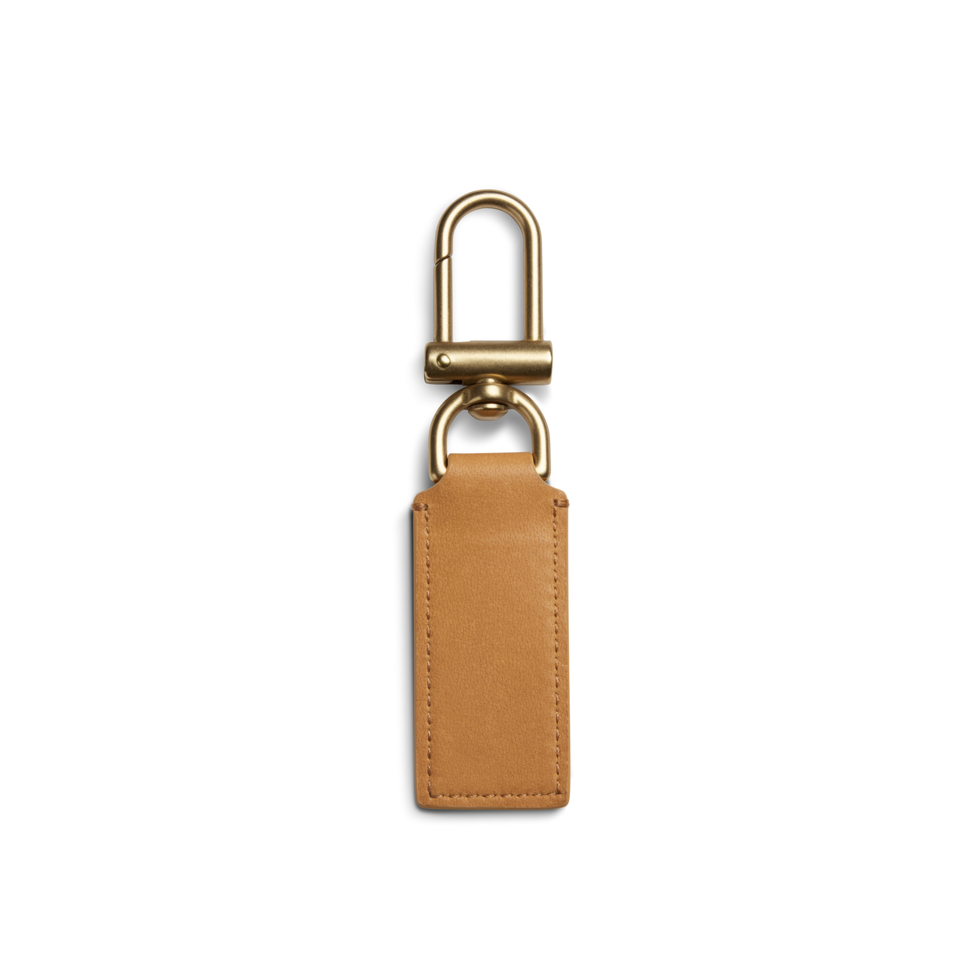 The Shinola Birdy Keychain - Honey is a tan leather key fob with a rectangular tag and gold hardware, featuring a rounded clasp and circular ring—perfect as an engravable accessory. Shown on a plain white background.