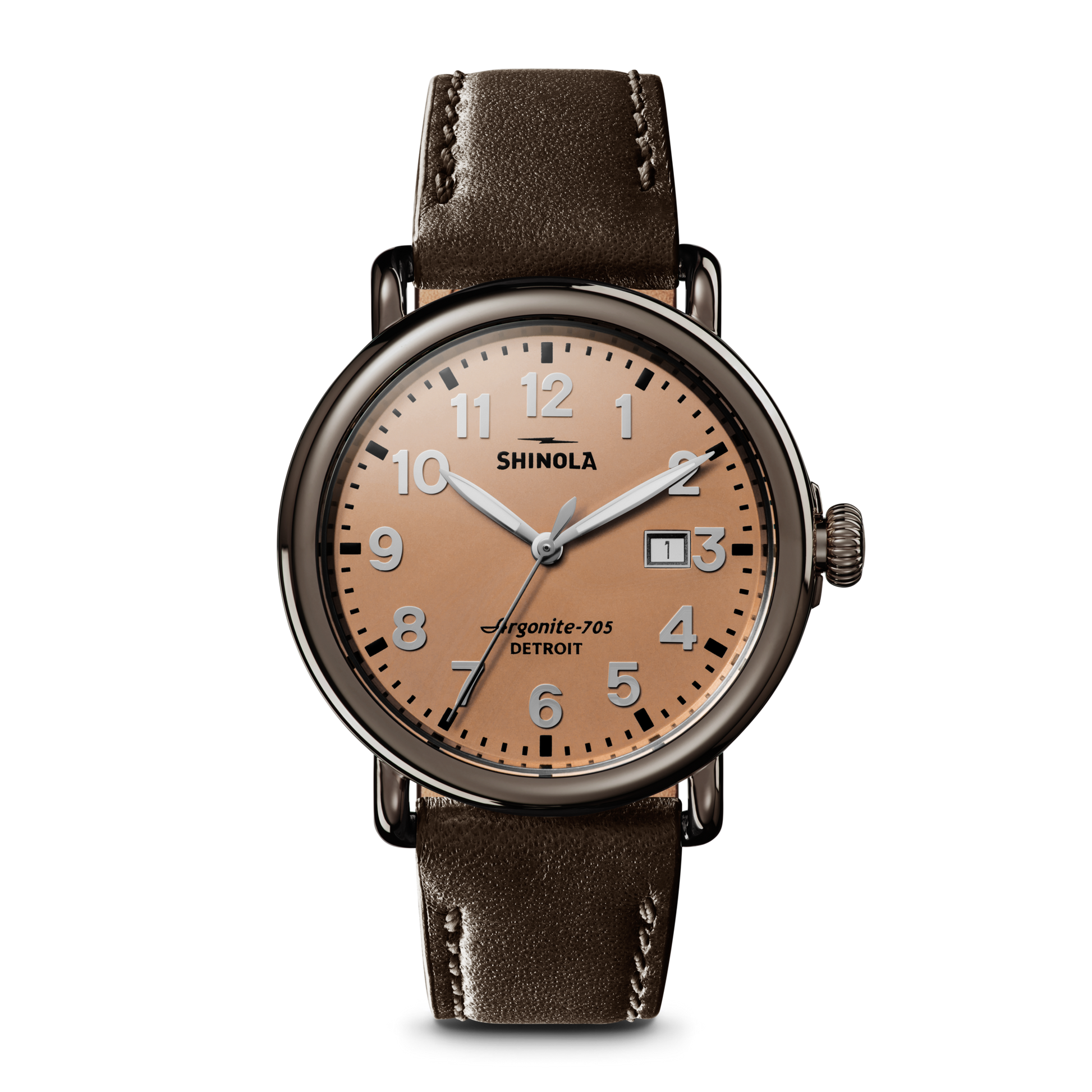 The Shinola Runwell Watch features a rose gold case, deep brown leather strap, round tan dial with silver hour markers and hands, date window at 3 o'clock, and displays "Shinola" and "Argonite-705 Detroit" on the face.