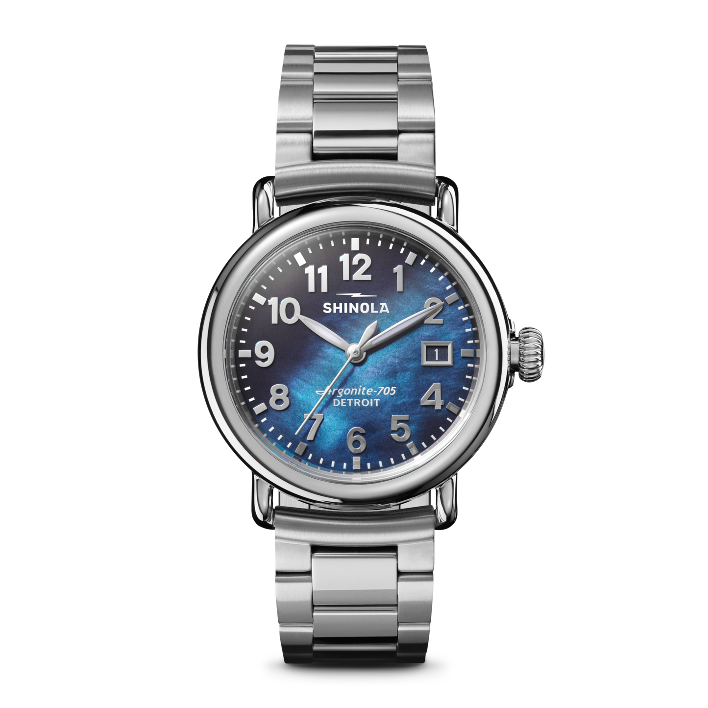 The Shinola Runwell Watch - Cadet Blue features a stainless-steel case and bracelet, cadet blue mother of pearl dial, white numerals, and a date window at 3 o’clock, shown against a plain white background.