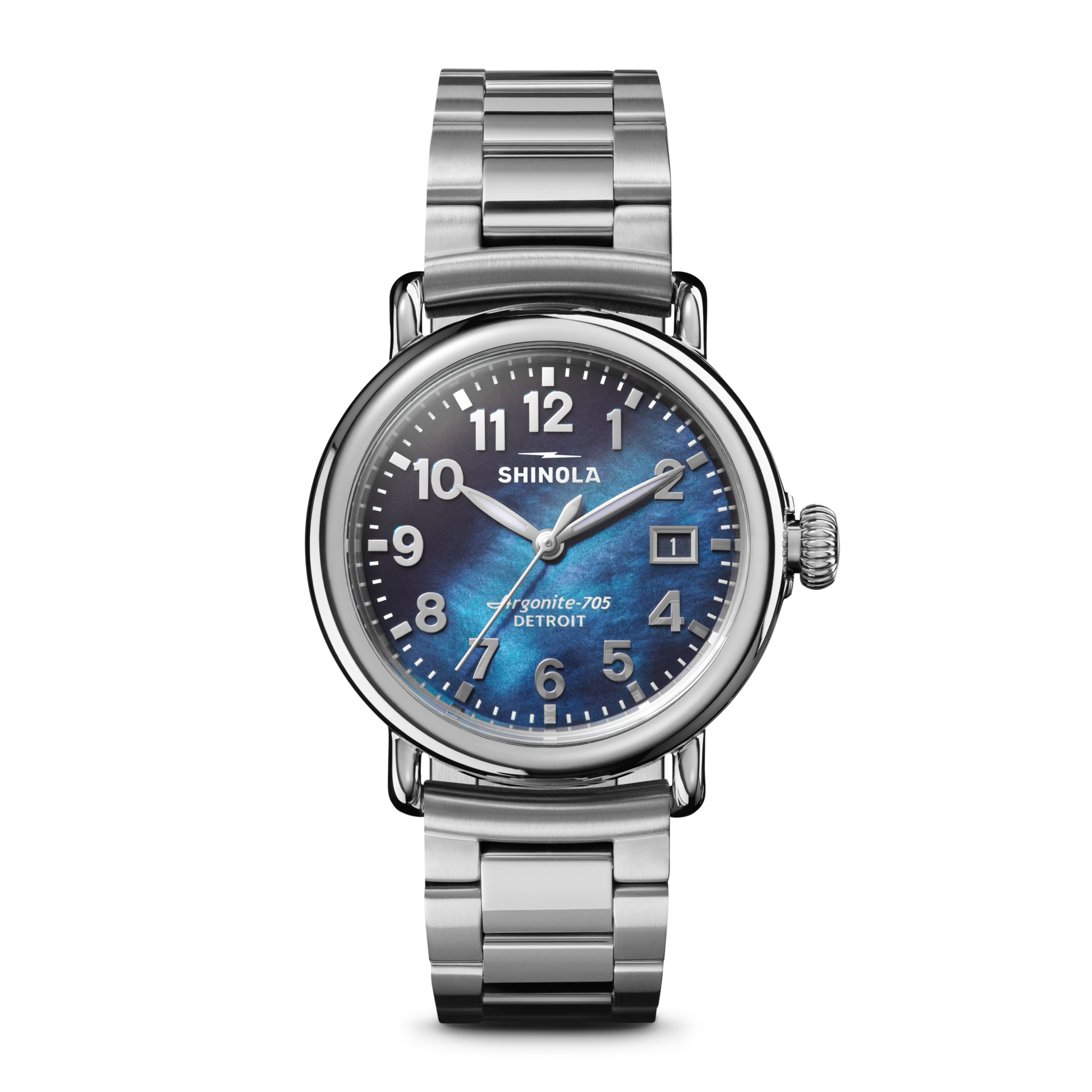 The Shinola Runwell Watch - Cadet Blue features a stainless-steel case and bracelet, cadet blue mother of pearl dial, white numerals, and a date window at 3 o’clock, shown against a plain white background.