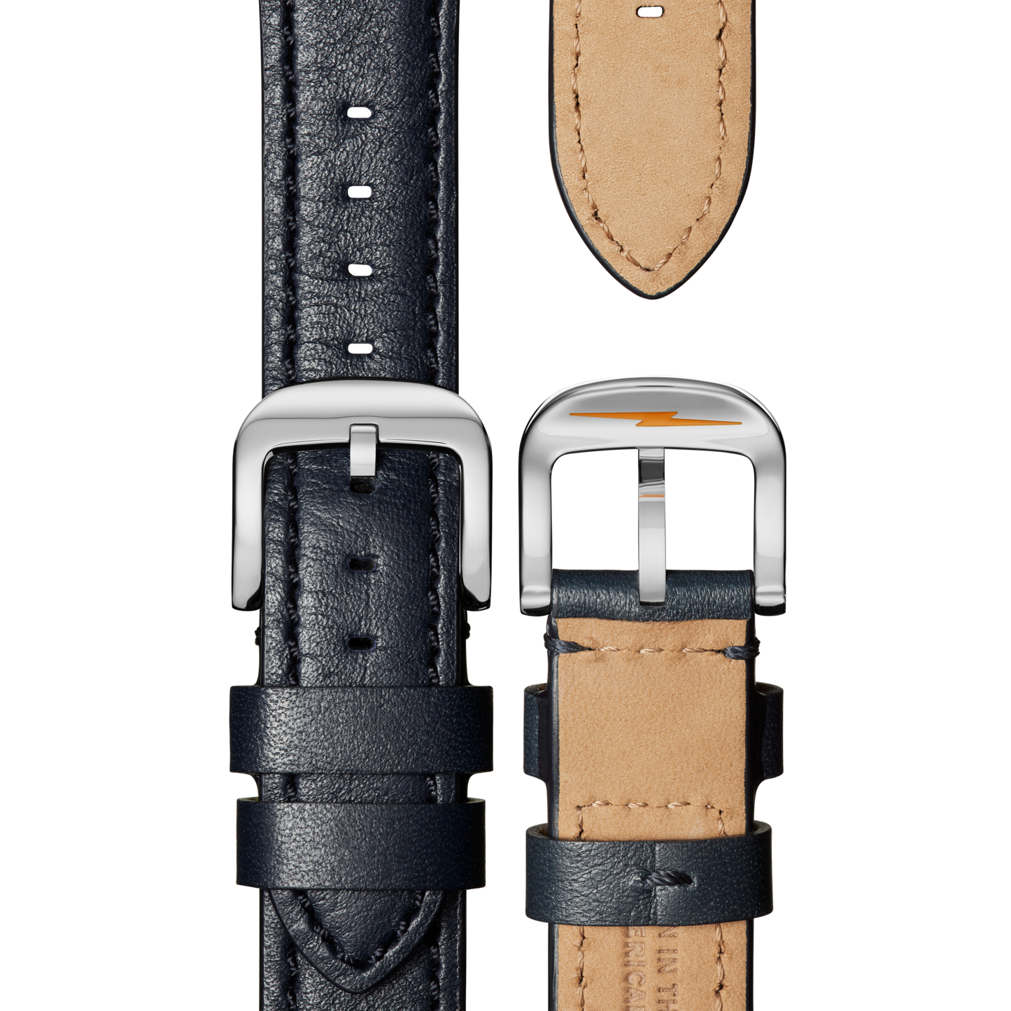 A close-up of the Shinola QR Strap: 20/18 Essence in Navy shows the textured leather, contrast stitching, tan underside, and silver buckle from both front and back.