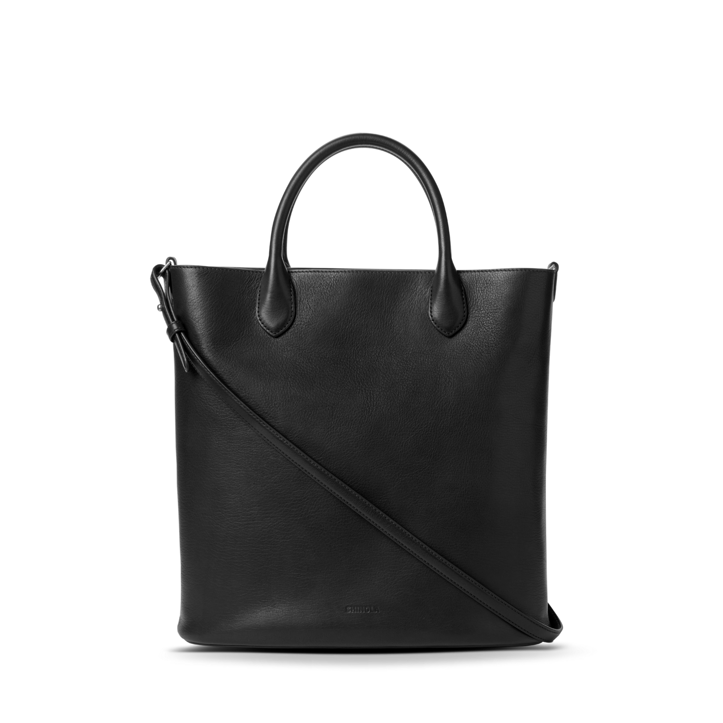 The Shinola 12 Hour Tote Bag - Black features short handles and a long, adjustable shoulder strap—ideal for everyday use—shown against a plain white background.