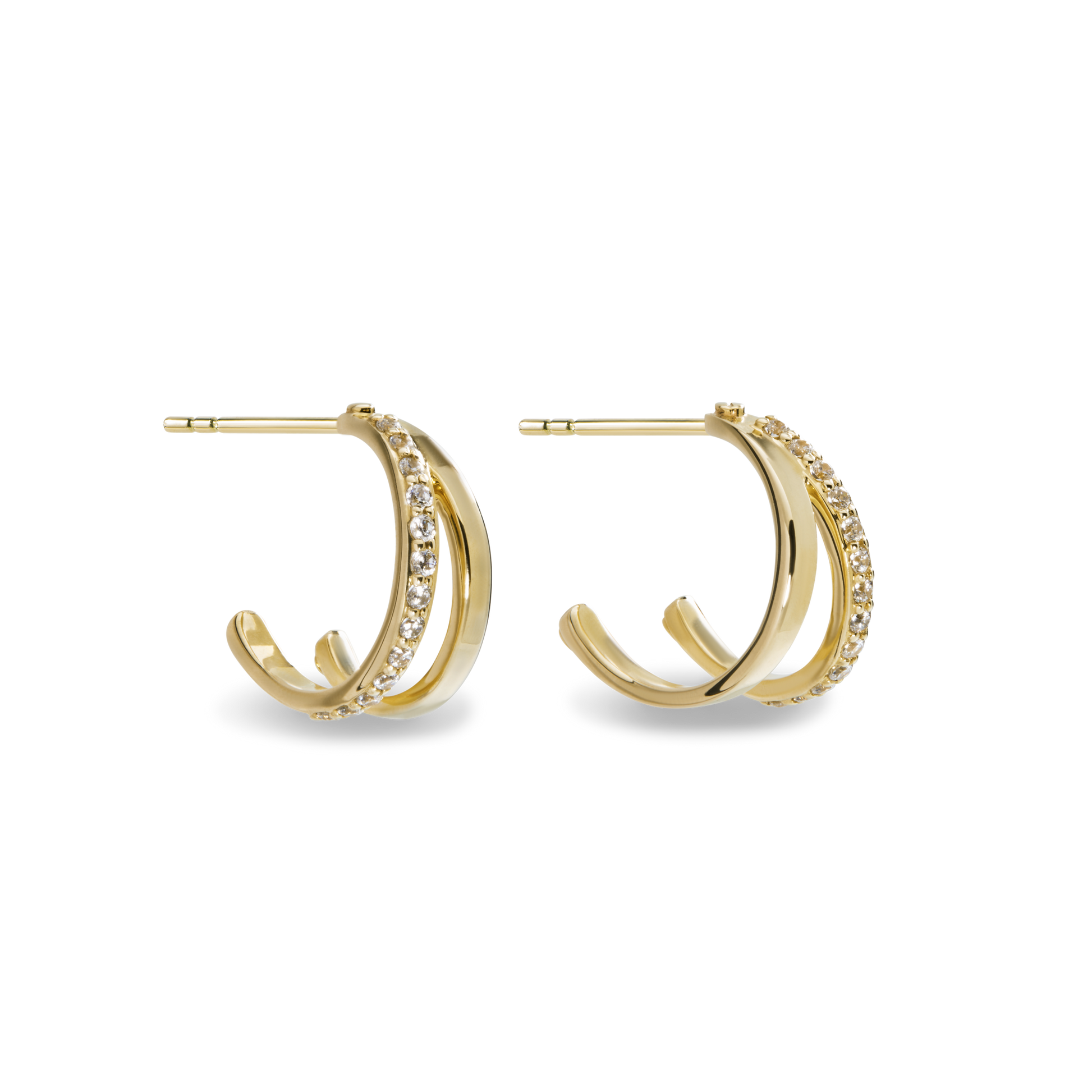 The Shinola Diamond Rivet Huggies are 14k yellow gold hoop earrings with two parallel bands—one plain, one set with brilliant cut diamonds—shown against a white background.