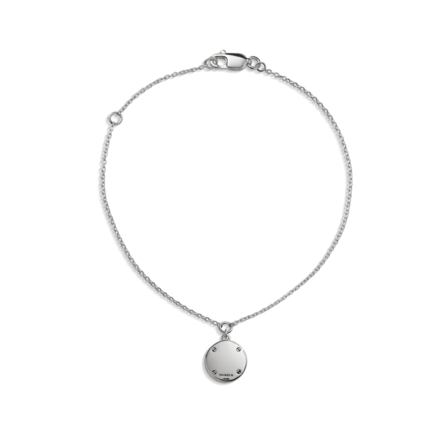 The Heirloom Turquoise Charm Bracelet by Shinola is a delicate sterling silver piece with a small round engravable pendant and lobster clasp, shown on a white background.