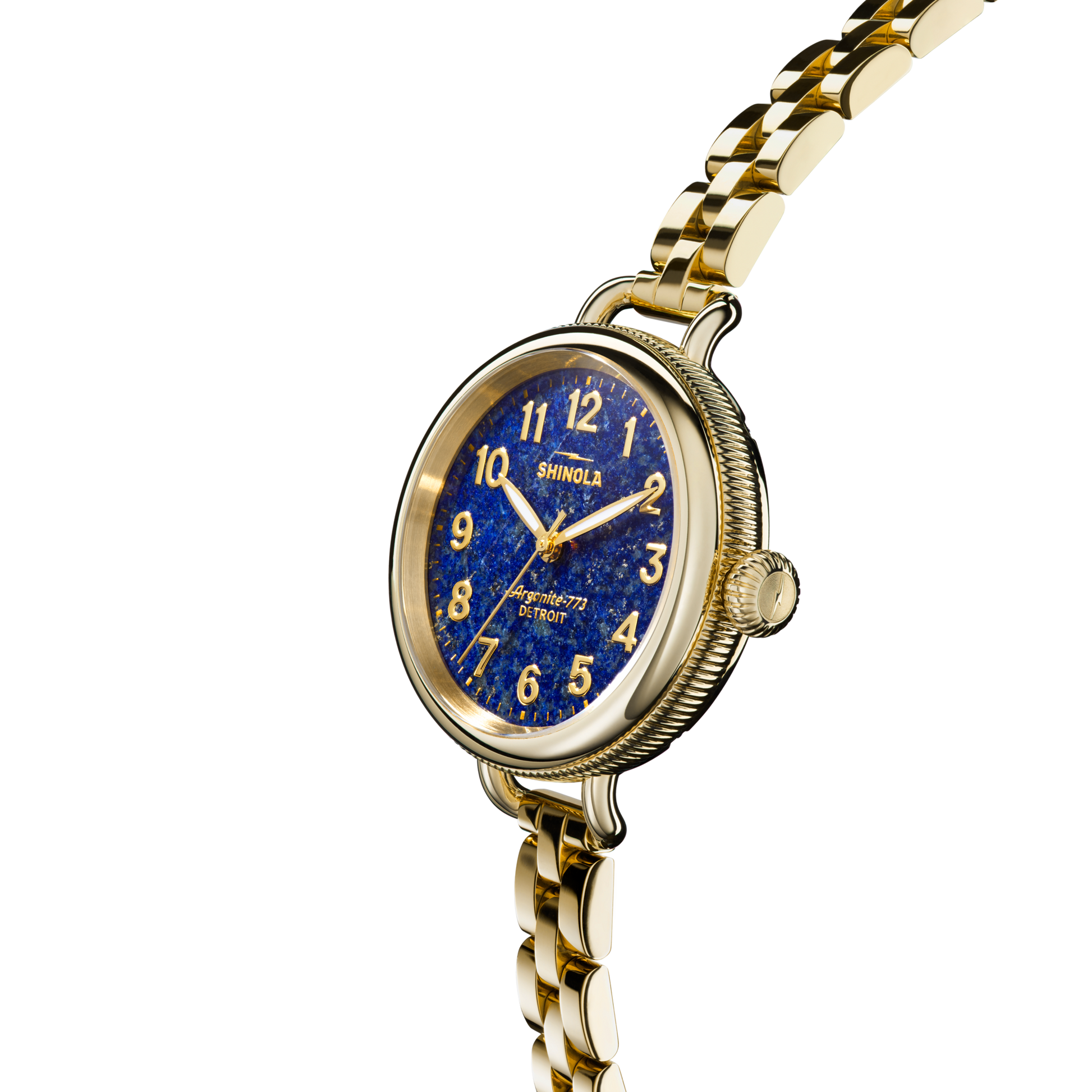The Shinola Birdy Watch - Lapis, assembled in Detroit, features a gold-tone case, blue lapis-inspired dial with gold numerals, metal link band, textured crown and case, and the Shinola name on the face against a plain white background.