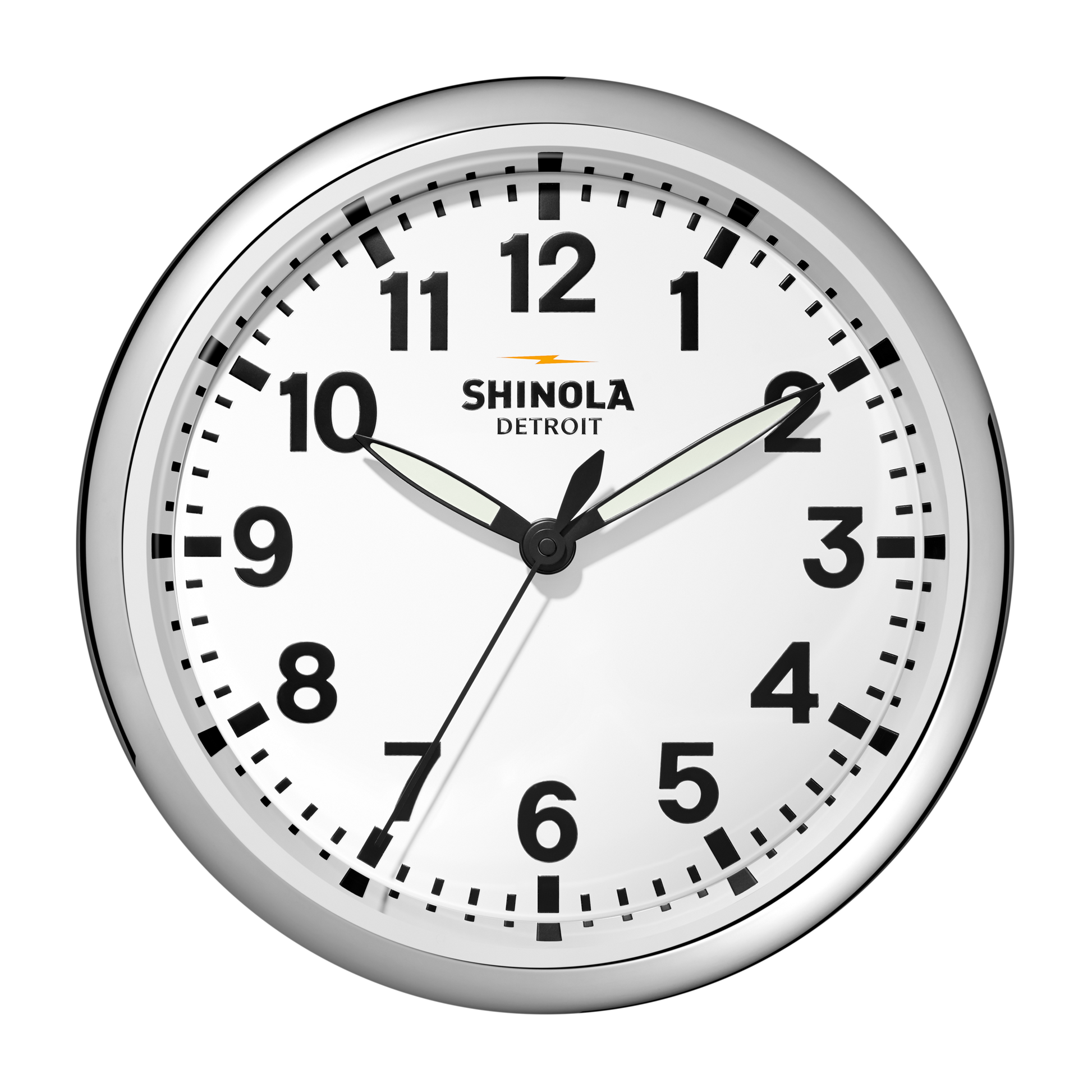 The 14" Runwell Clock by Shinola features a white face, chrome casing, black numbers, and black hour and minute hands set to 1:50:34. The Shinola brand name is displayed on this classic wall clock.