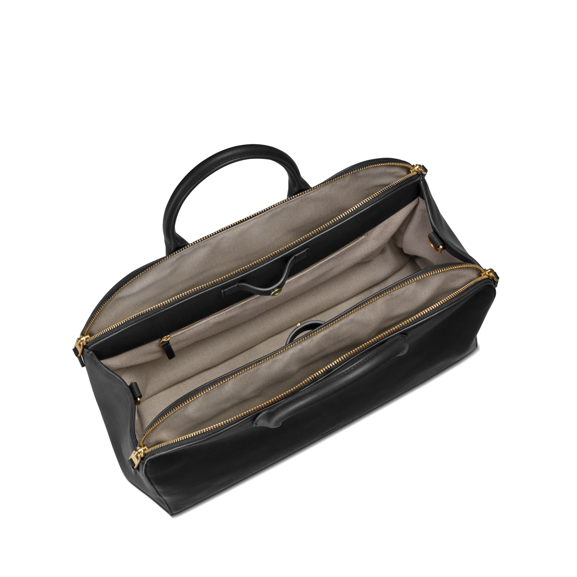 The Shinola Bixby Work Satchel in black has two spacious compartments with a divider, gold zippers, interior pockets, and a single top handle. Shown empty from above, it’s perfect as a stylish laptop bag.