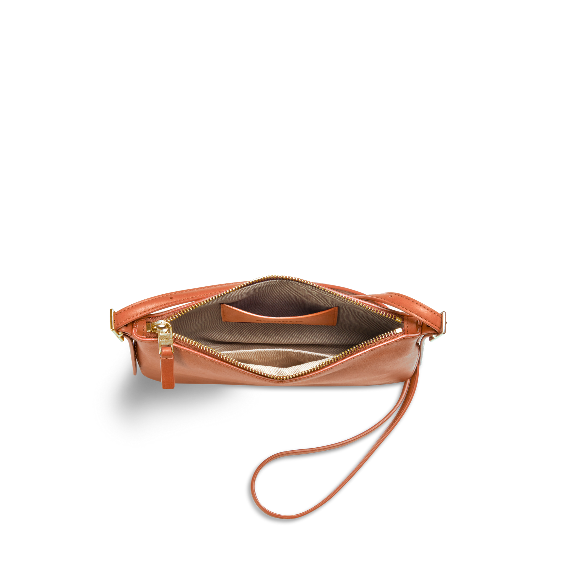 The Small Bixby Crossbody in Rust by Shinola features natural leather, a gold zipper, beige fabric lining, and an inner pocket—photographed from above on a white background. An ideal everyday accessory.