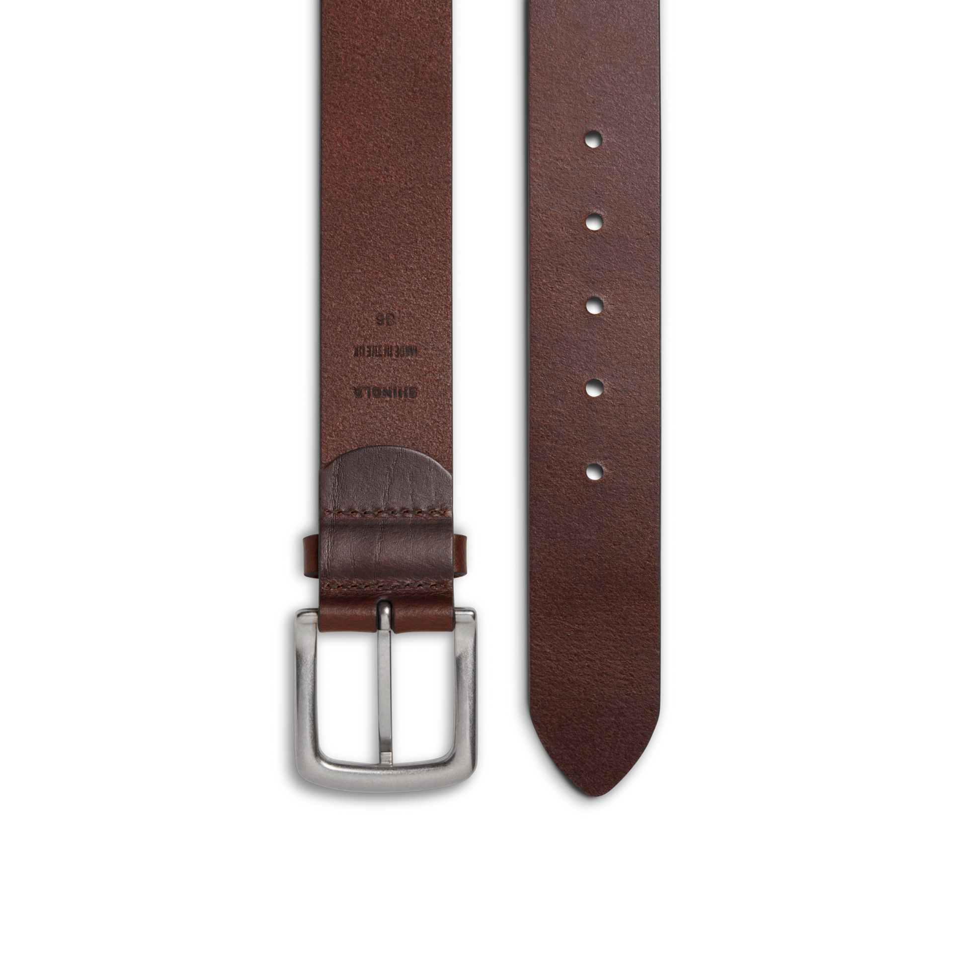The Shinola 1 1/2" Essential Belt in Dark Brown natural leather features a silver rectangular buckle, five adjustment holes, and a stamped label near the buckle, displayed on a white background.