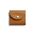 The Shinola Birdy Small Snap Wallet in tan leather, with a rounded flap and gold snap button, features card pockets and is shown on a white background with a subtle left shadow.