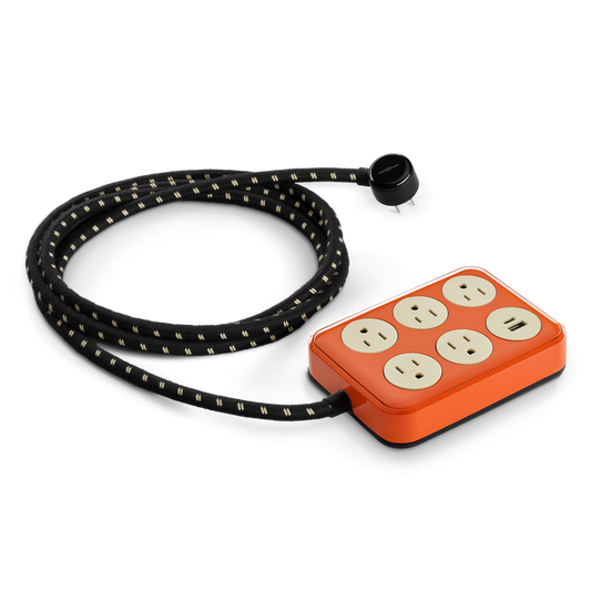 The Shinola 5 Port Power Supply - Tangerine features a tangerine body with five cream outlets, two USB A + C ports, and a long black-and-white fabric-covered cord.