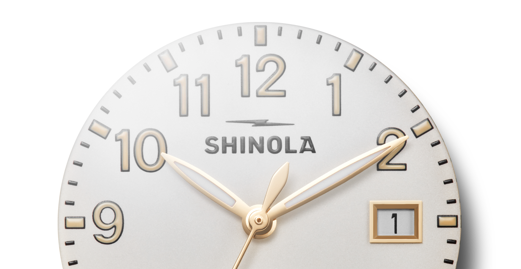Close-up of the Shinola Runwell Watch - Alabaster, featuring a gold stainless steel case with gold hour, minute, and second hands set at 10:10:08. The date window shows "1" on a white background with bold black numerals.