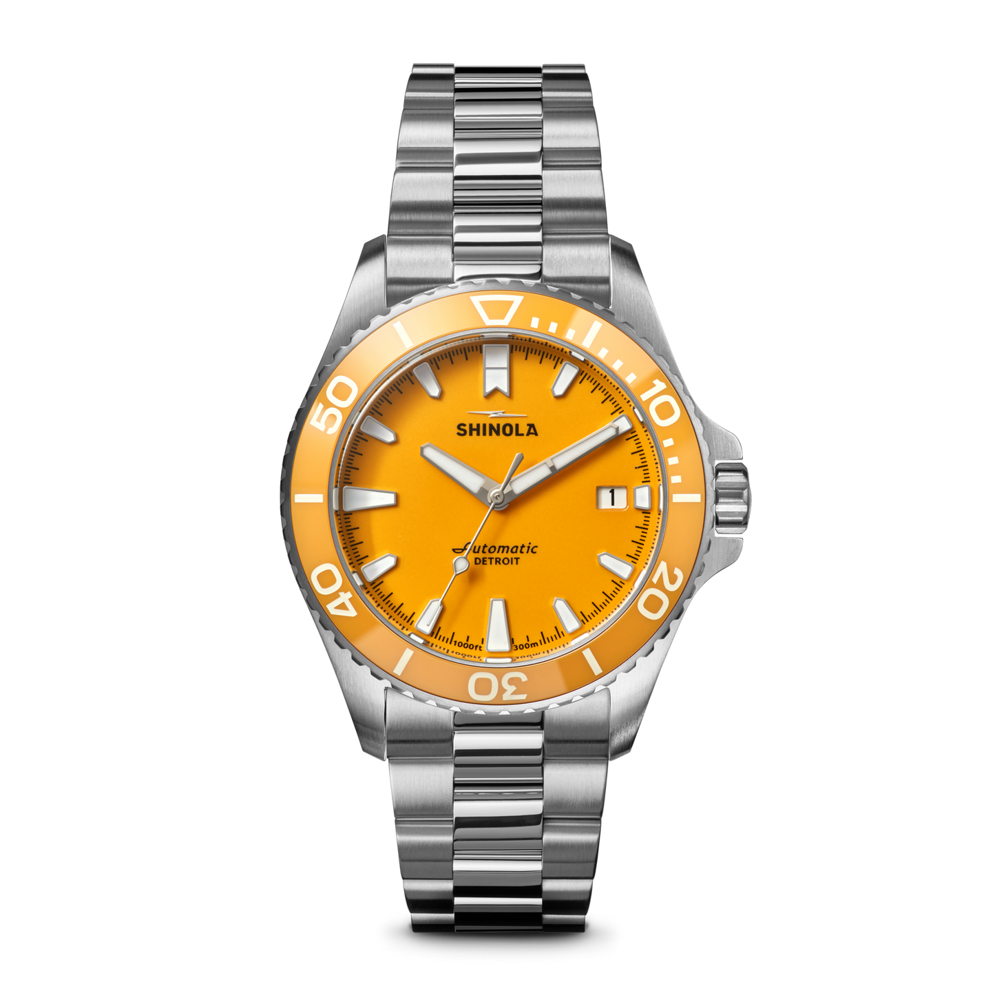 The Shinola Lake Huron Monster Automatic Dive Watch features a stainless steel case, silver metal band, bright orange face, white hour markers and hands, minute indices, and the Shinola name above the center.