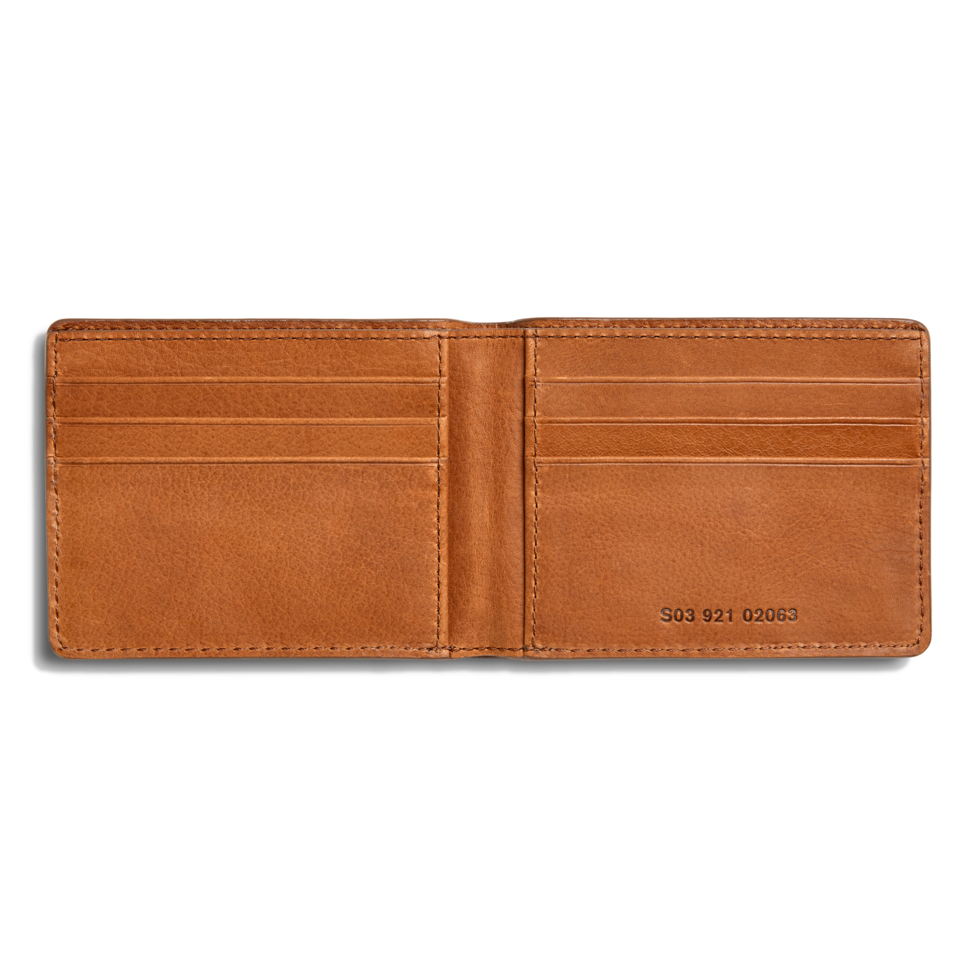 The Shinola Slim Bifold Wallet - Tan features premium brown leather, six card slots, and a visible serial number inside on the lower right. Its clean interior is showcased in a photo taken against a white background.