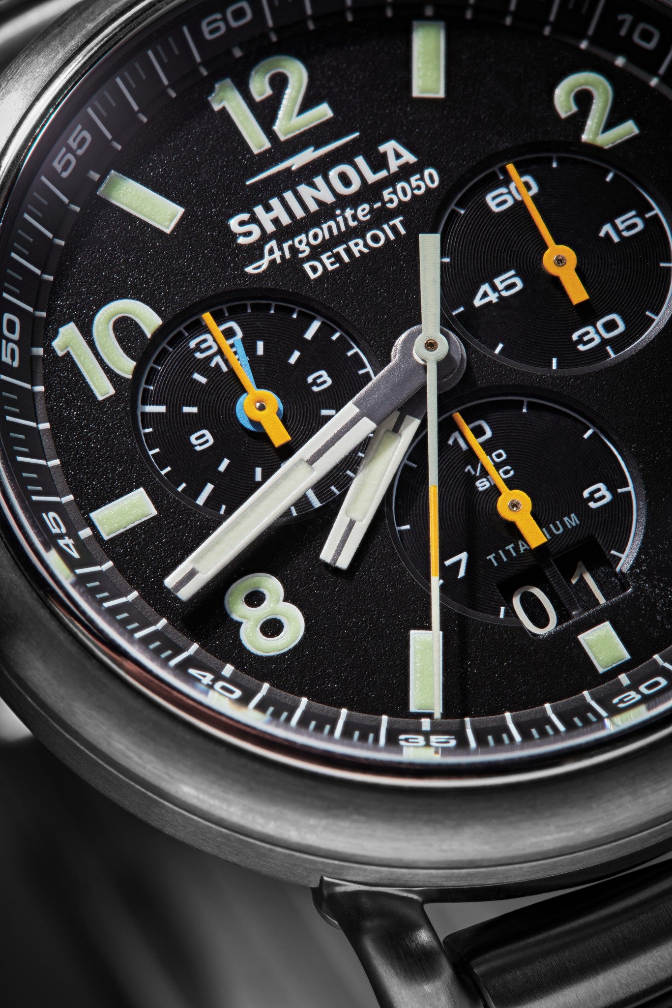 Close-up of the Shinola Runwell Chronograph West Wind Watch Gift Set with Additional Strap in Black, featuring large numerals, three subdials, yellow-accented hands, a date window, and 20 ATM water resistance; time shows 8:21:05.