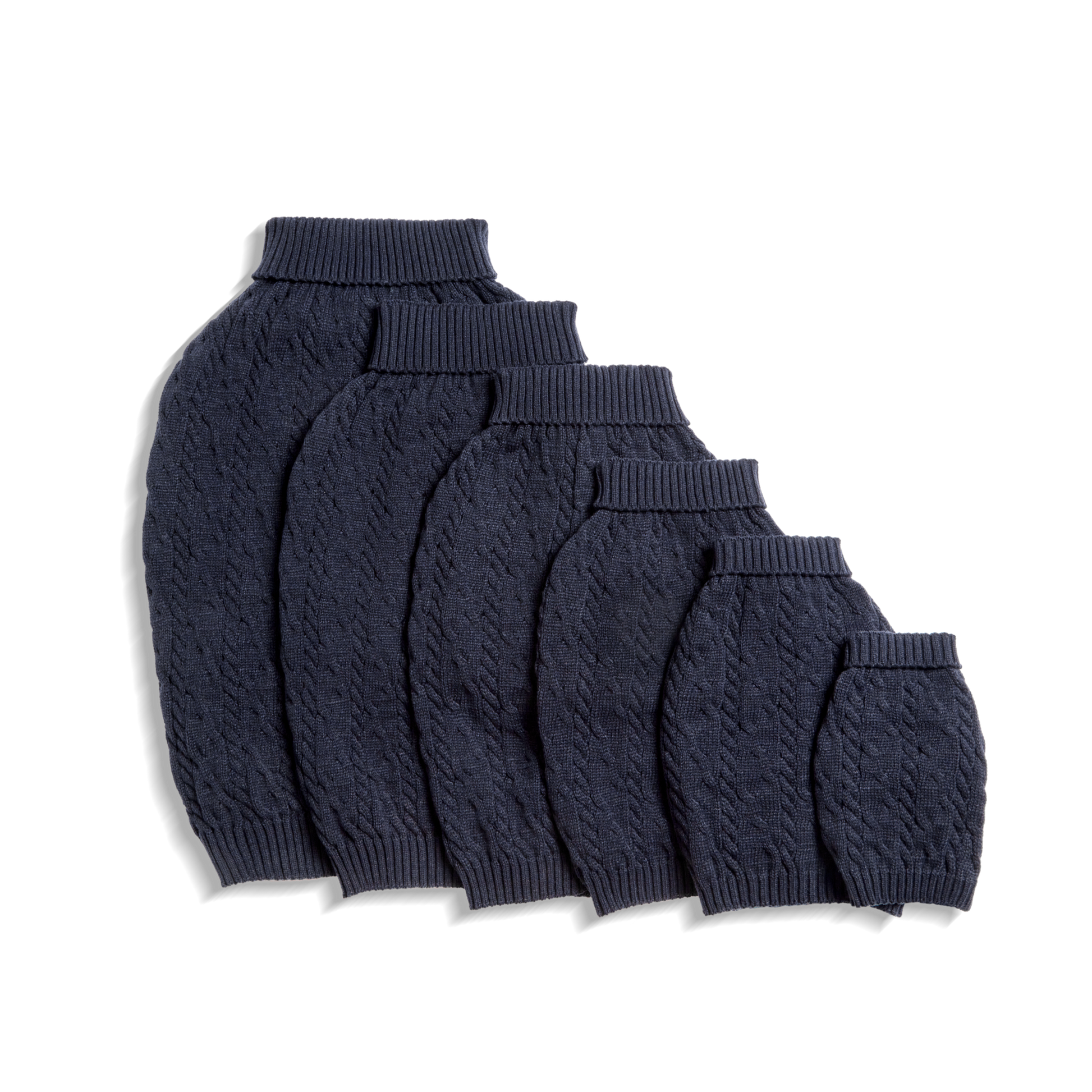 Five Shinola Cable Knit Dog Sweaters in navy are arranged from largest to smallest in a row on a white background.