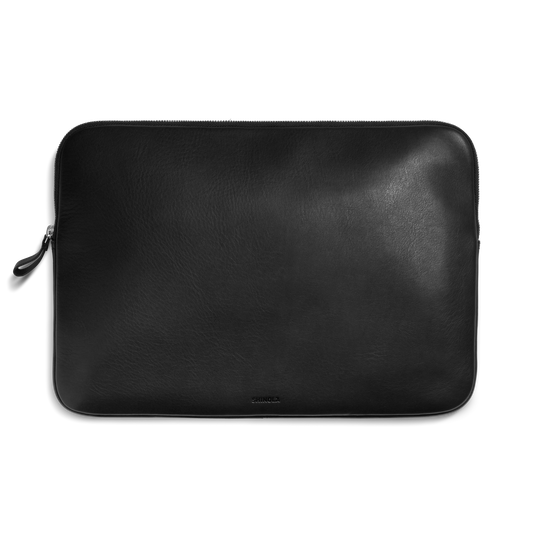 The Shinola Laptop Tech Case - Black is a sleek leather zippered sleeve that doubles as an elegant accessory organizer, shown here against a plain white background.