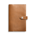 The Shinola Medium Snap Journal Cover in Tan Vachetta features visible edge stitching and a snap-button closure, crafted from Italian leather, shown against a plain white background.