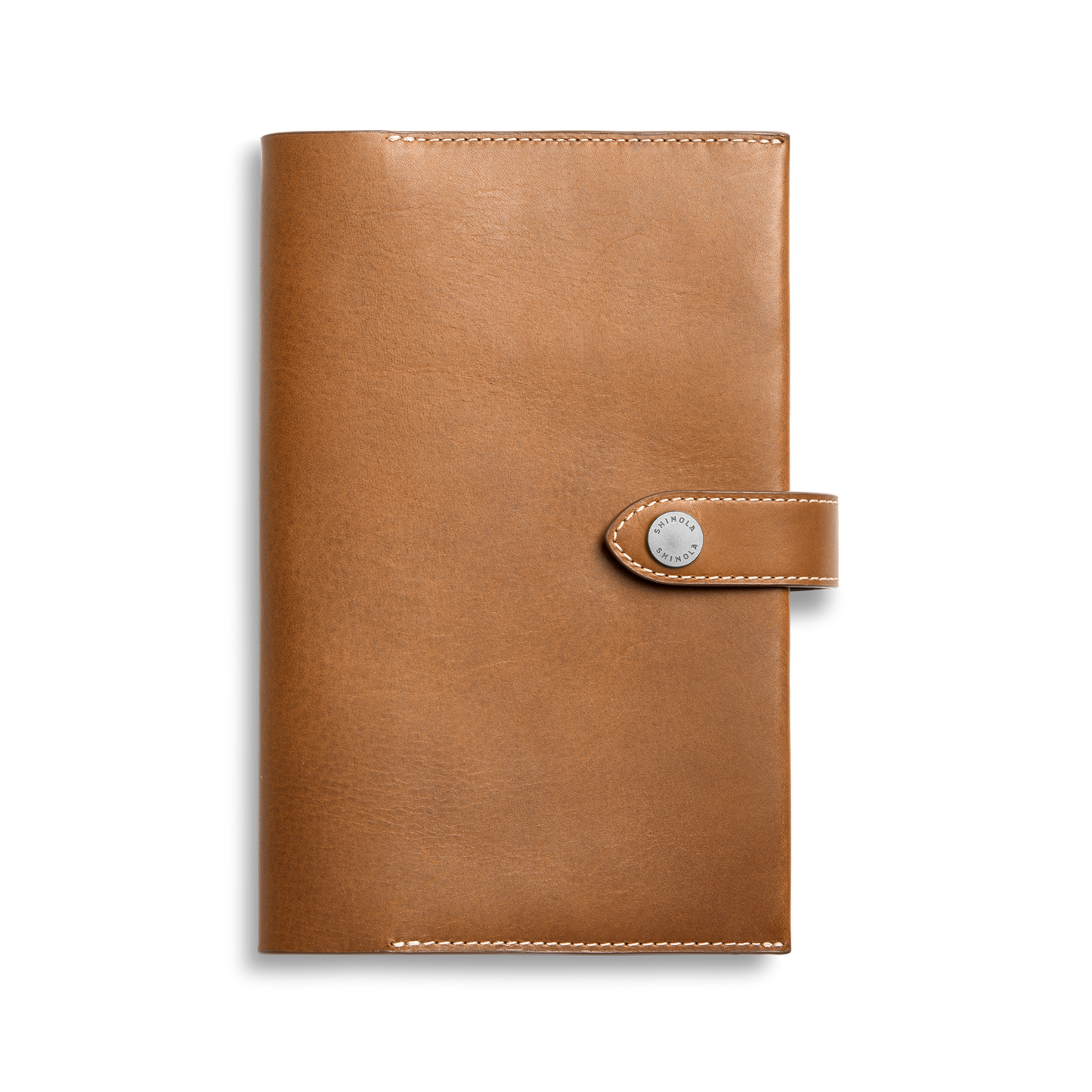 The Shinola Medium Snap Journal Cover in Tan Vachetta features visible edge stitching and a snap-button closure, crafted from Italian leather, shown against a plain white background.