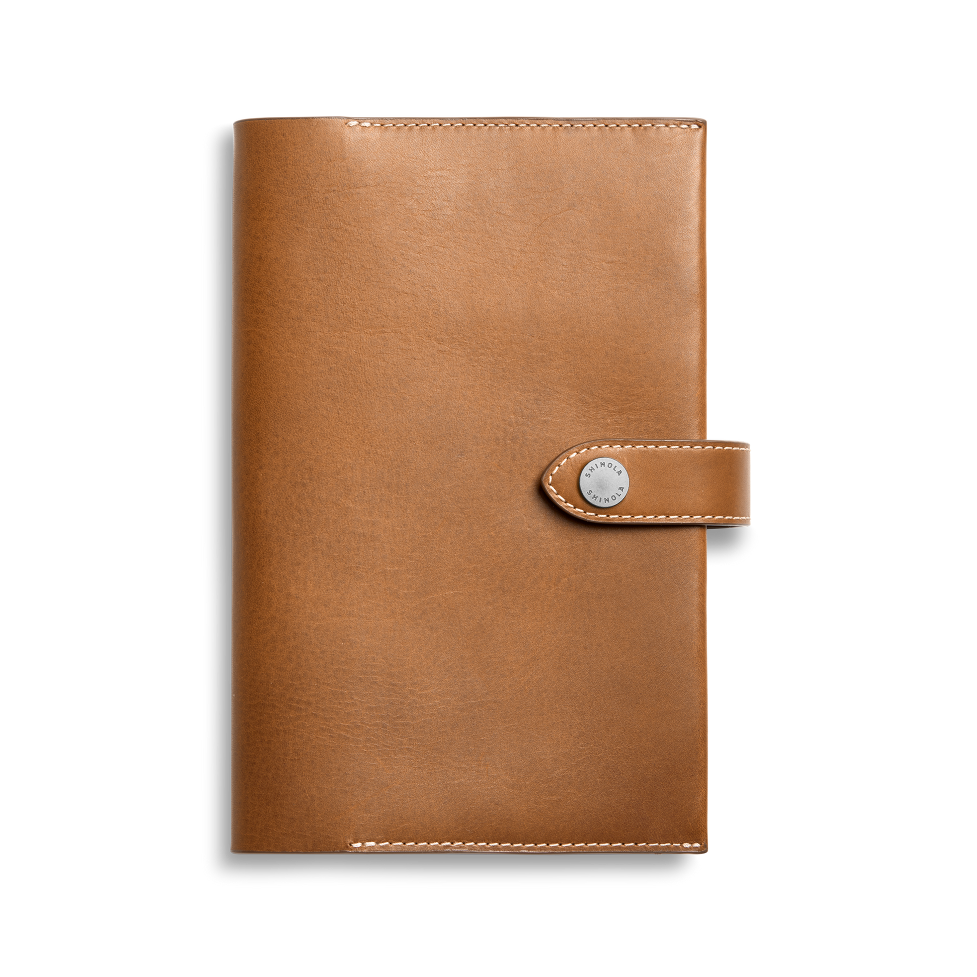 The Shinola Medium Snap Journal Cover in Tan Vachetta features visible edge stitching and a snap-button closure, crafted from Italian leather, shown against a plain white background.
