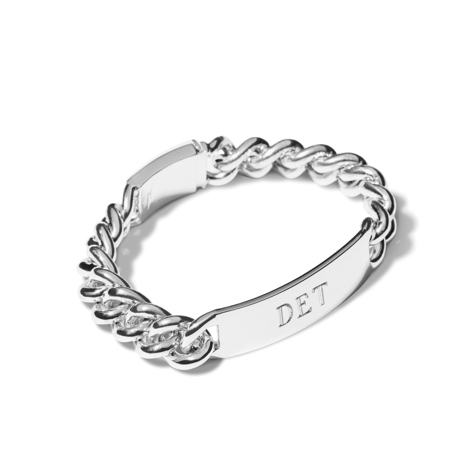 The Shinola Bike Lock ID Bracelet in sterling silver features chunky, interlocking links, a secure clasp, and a flat engravable ID plate with "DET" on a white background for bold everyday style.