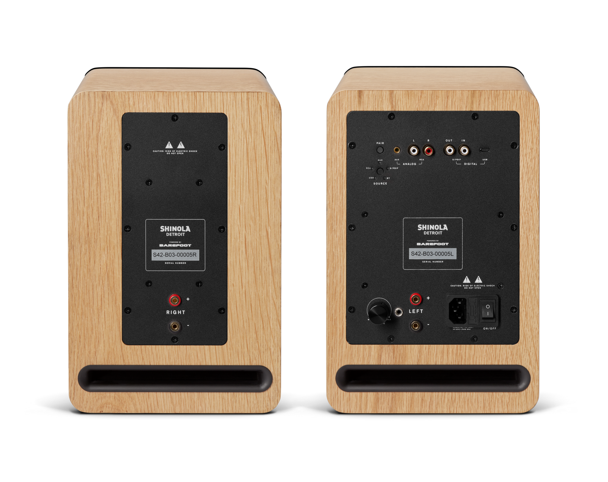The Shinola Bluetooth Bookshelf Speakers - Natural are shown from the back, featuring input/output ports, a control panel, and right/left labels on a plain background.