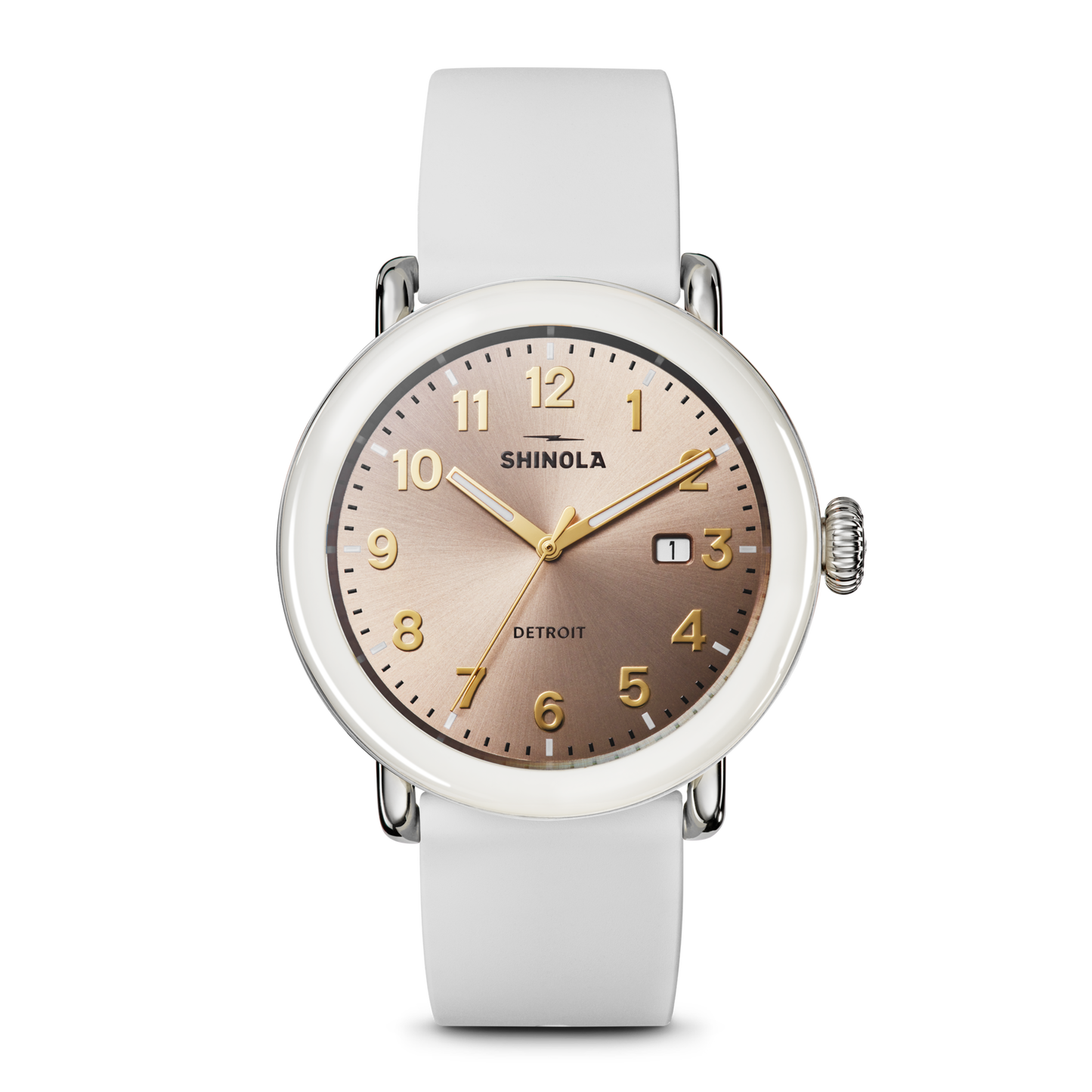 The Shinola Detrola Watch - Nude features a round, rose-gold dial with gold numerals and hands, a small date window, and a white leather strap, embodying classic American design.