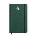 The Shinola Medium Hard Ruled Journal - Forest features a green hardcover, elastic band closure, white Spartan helmet logo on the front, and acid-free paper—perfect for lasting Michigan State University notes.