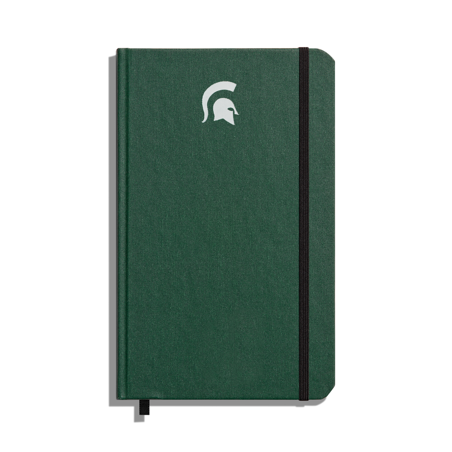 The Shinola Medium Hard Ruled Journal - Forest features a green hardcover, elastic band closure, white Spartan helmet logo on the front, and acid-free paper—perfect for lasting Michigan State University notes.