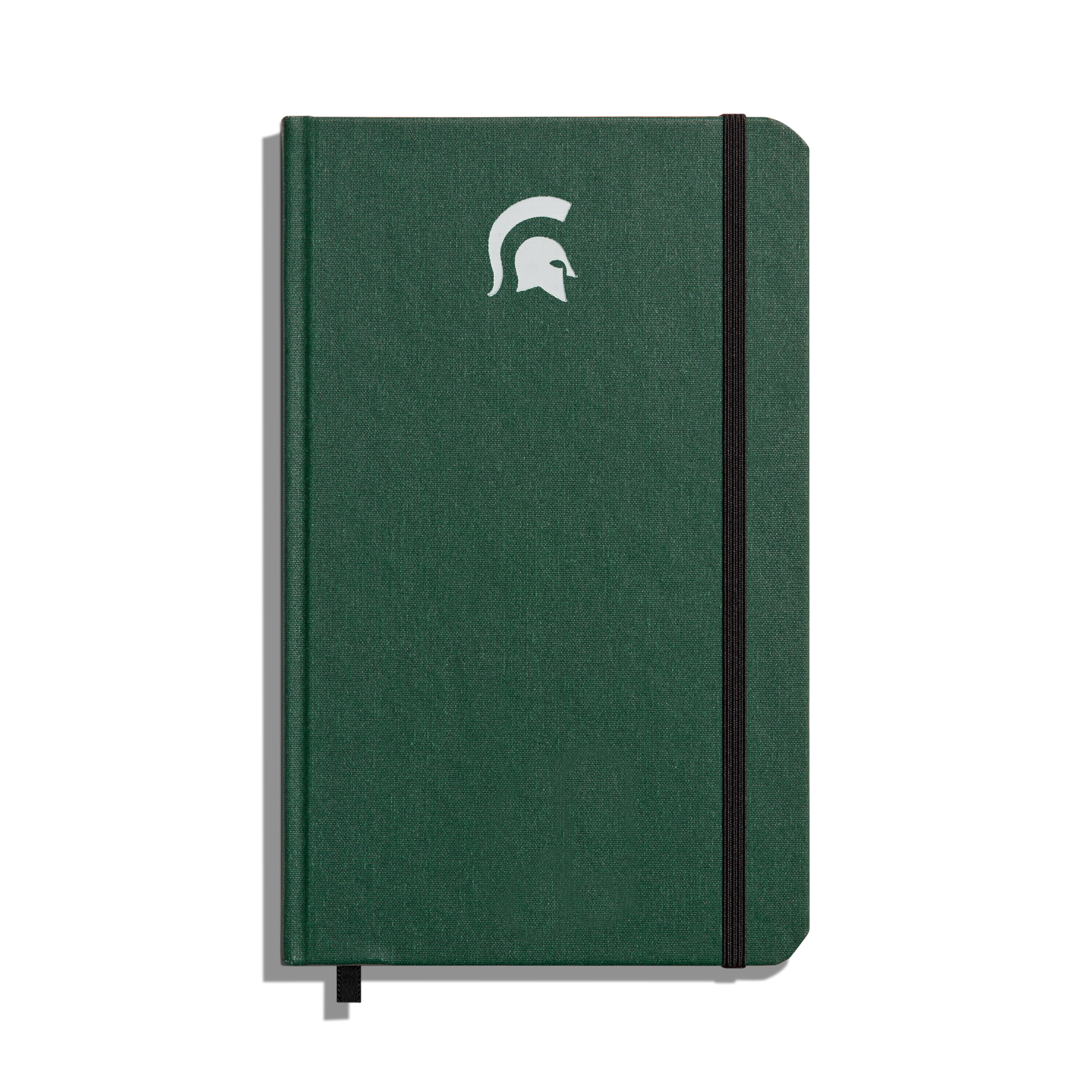 The Shinola Medium Hard Ruled Journal - Forest features a green hardcover, elastic band closure, white Spartan helmet logo on the front, and acid-free paper—perfect for lasting Michigan State University notes.