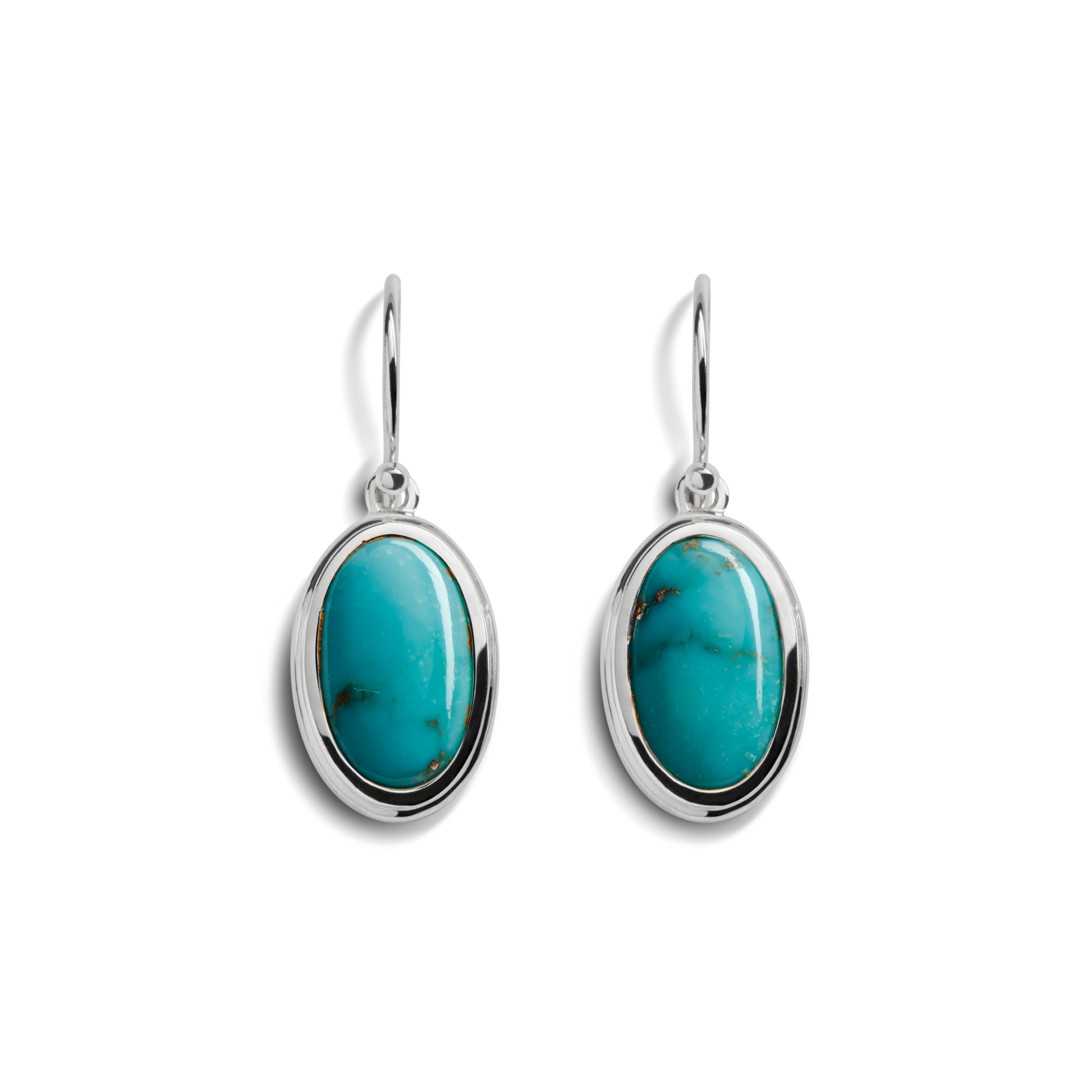The Shinola Heirloom Drop Turquoise Earrings feature oval turquoise stones set in sterling silver frames with simple hooks, showcased on a white background.