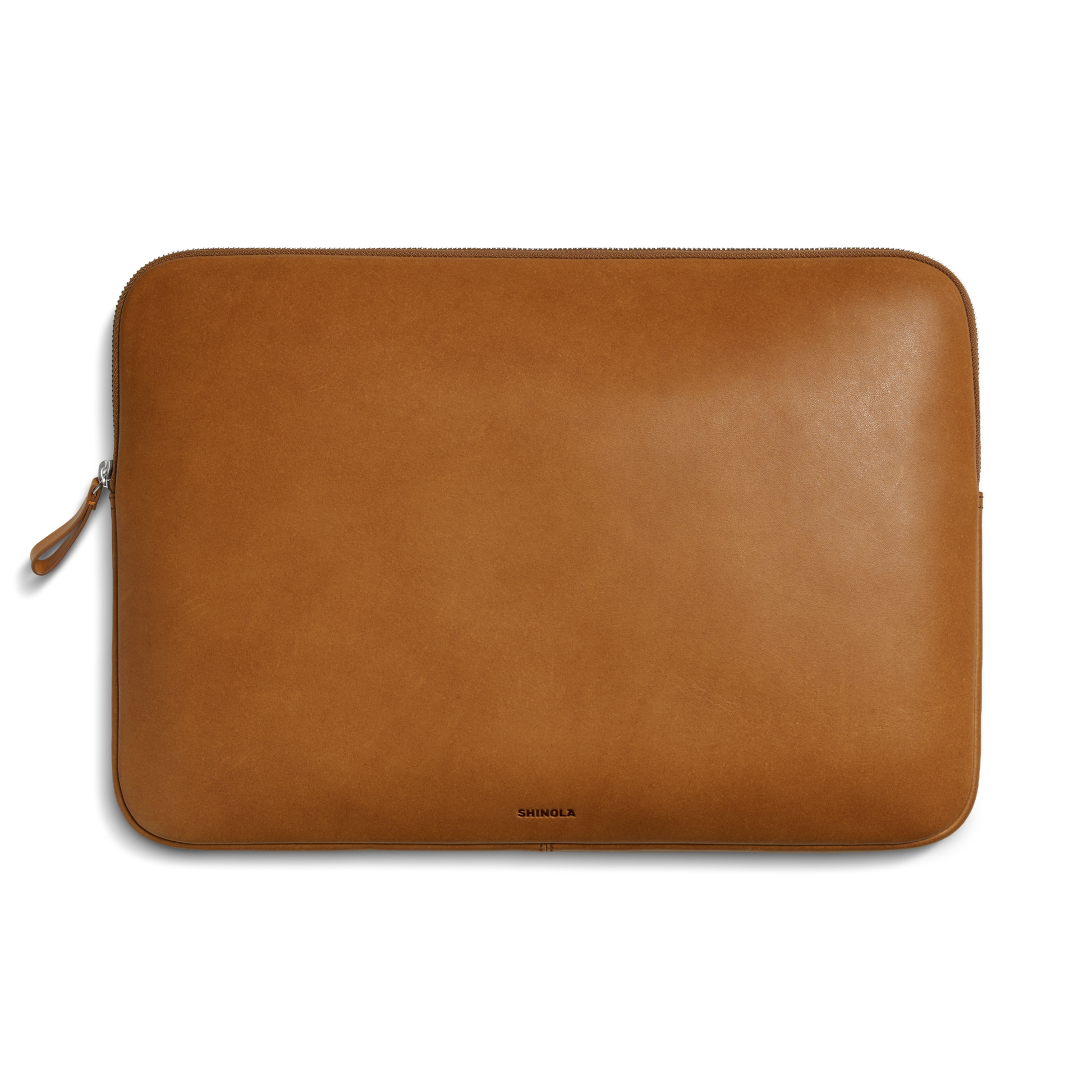 The Laptop Tech Case - Tan by Shinola is a rectangular tan leather sleeve with a top zipper and the Shinola logo near the bottom center, shown against a plain white background.