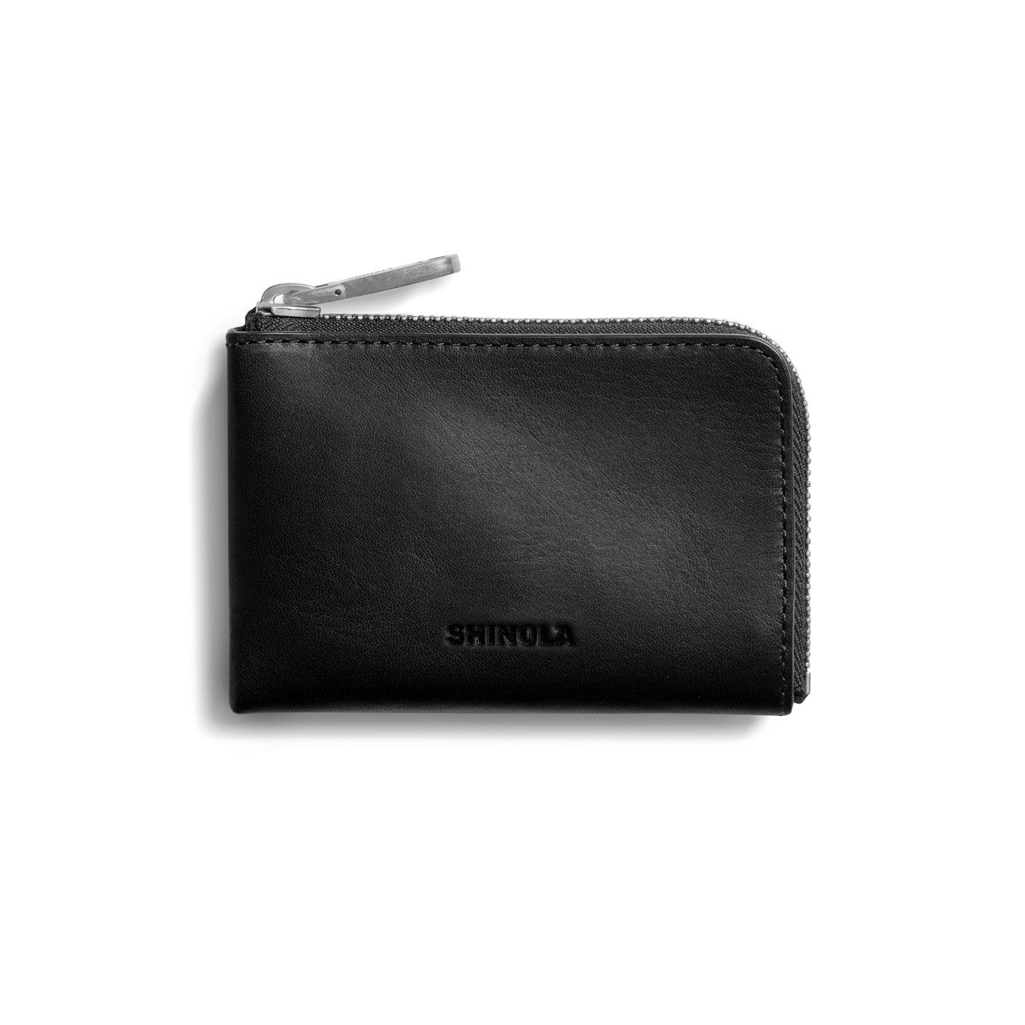 The Zip Key Wallet - Black by Shinola features black vegetable tanned leather, a silver zipper, and Shinola embossed on the front, displayed against a plain white background.