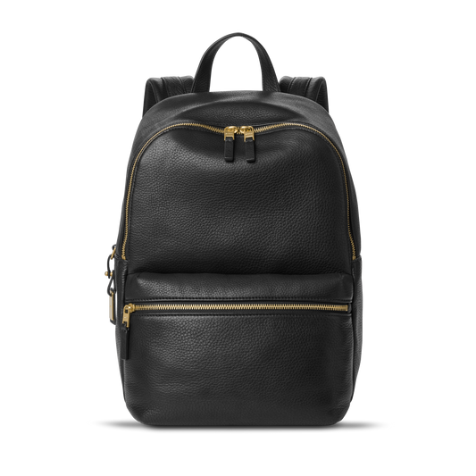 The Shinola Small Runwell Backpack in black natural grain leather features gold zippers, a top handle, and two straps—perfect for adding everyday style in a compact design.