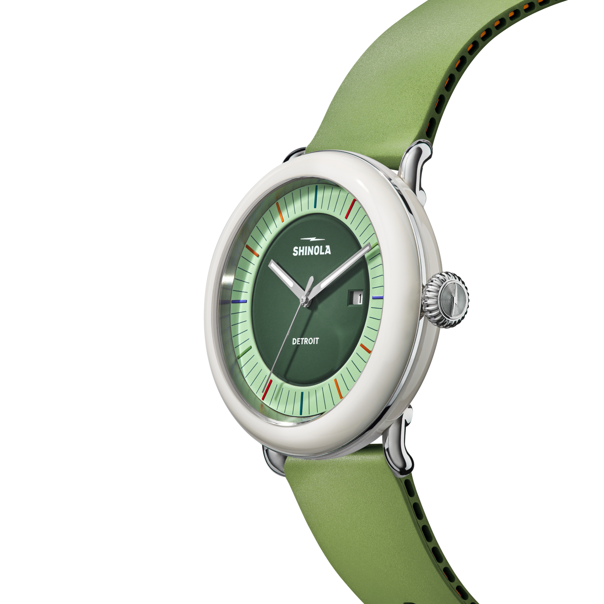 The Shinola Detrola Watch - Deep Olive features a green dial with silver hands, red and light green markers, a silver case, light green leather strap, right-side crown, and "Shinola Detroit" on the face for an art-inspired look.