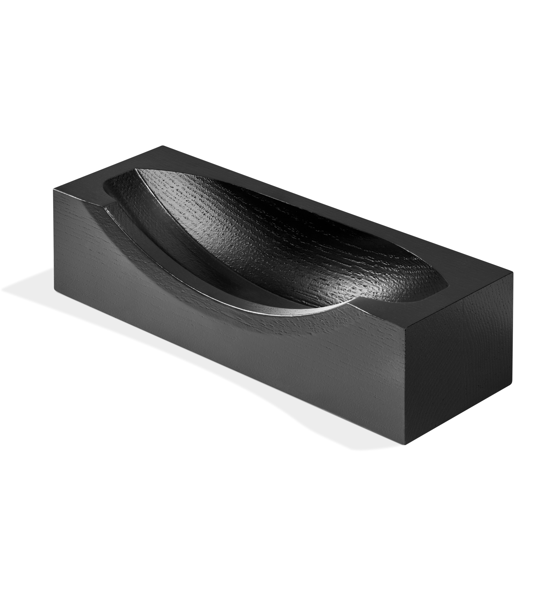 A rectangular, black wooden block with a smooth, curved indentation on top—the Clock Stand - Black by Shinola—displayed on a white background. Designed to complement the Shinola x GE collection.
