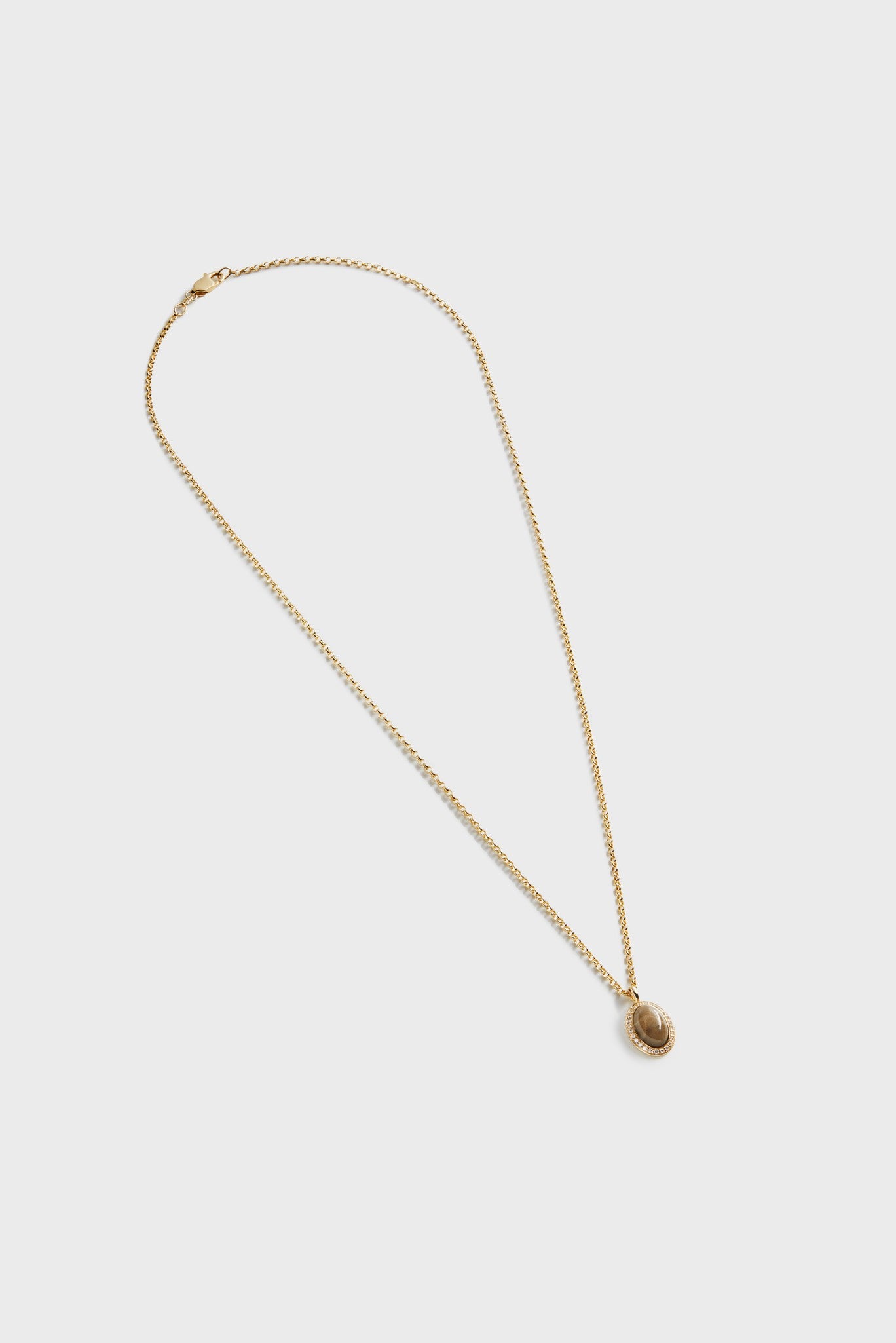 The Shinola Diamond Petoskey Petite Necklace in yellow gold features a small round pendant, shown against a plain white background.